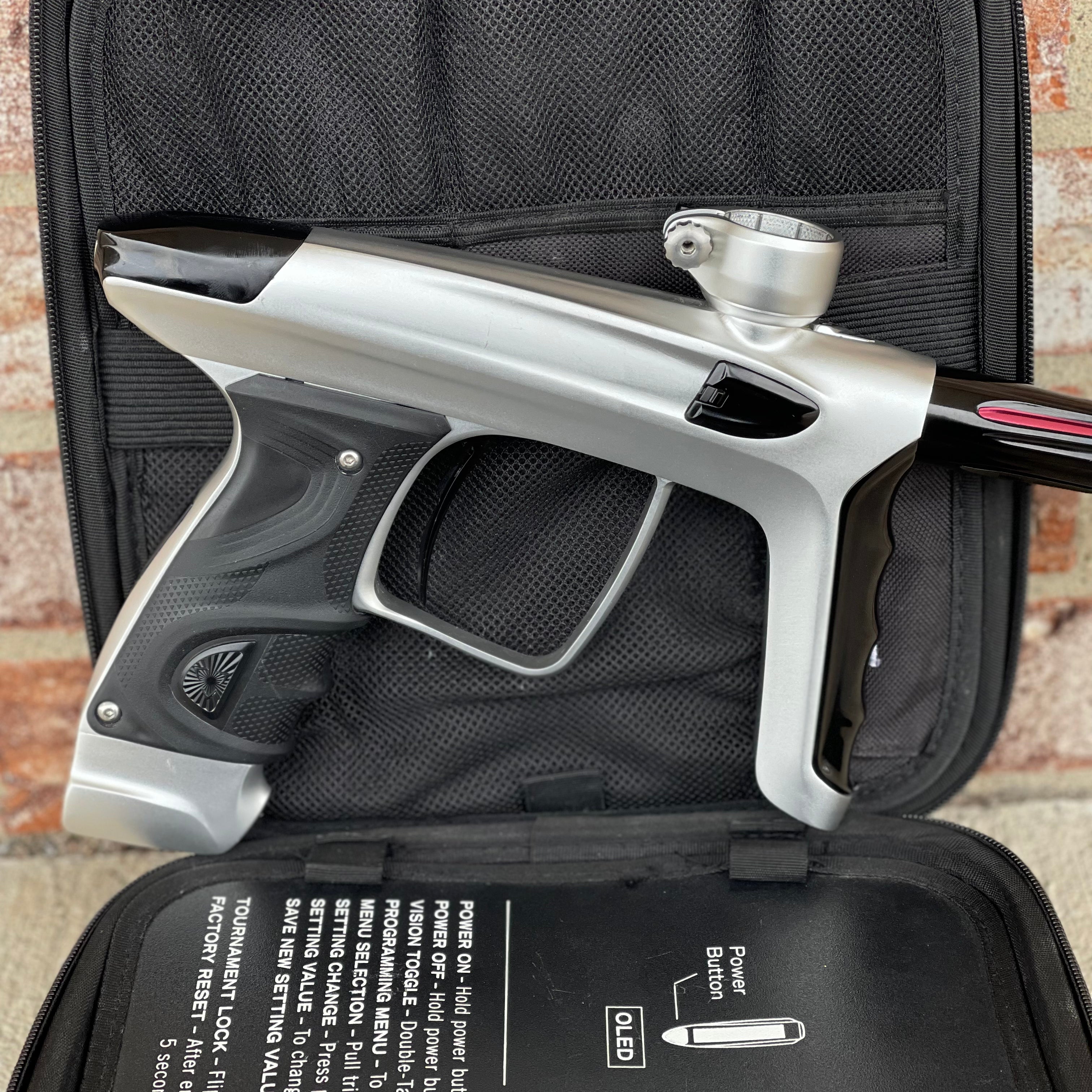 Used DLX Luxe TM40 Paintball Gun - Dust Silver/Gloss Black w/ Stock Bolt and SSC Bolt