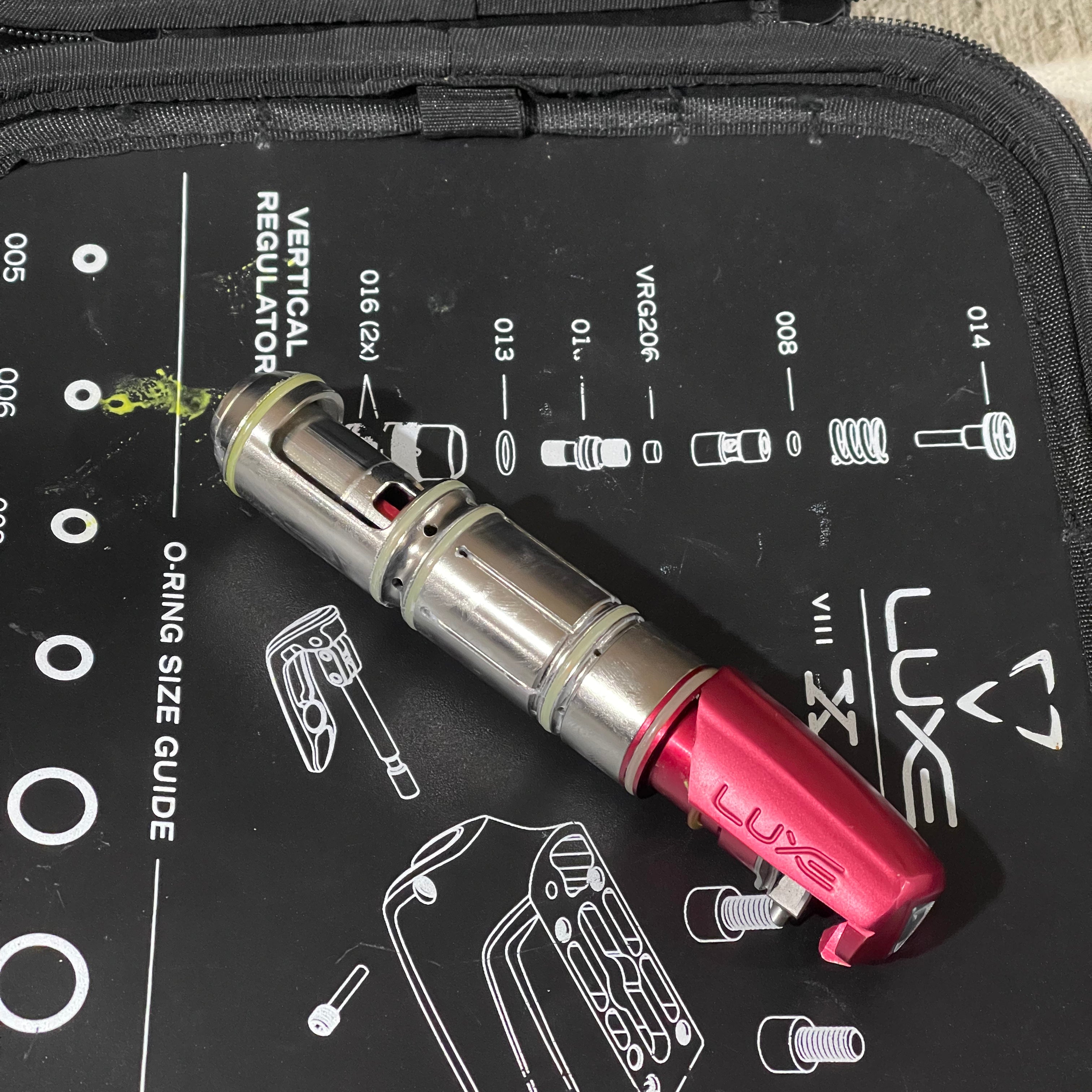 Used DLX Luxe Ice Paintball Gun - Dust Red / Dust Red w/ Inception Barrel, Encore Bolt/Stock Bolt, Scythe Trigger and Stock Trigger, Large Spare Part Kits