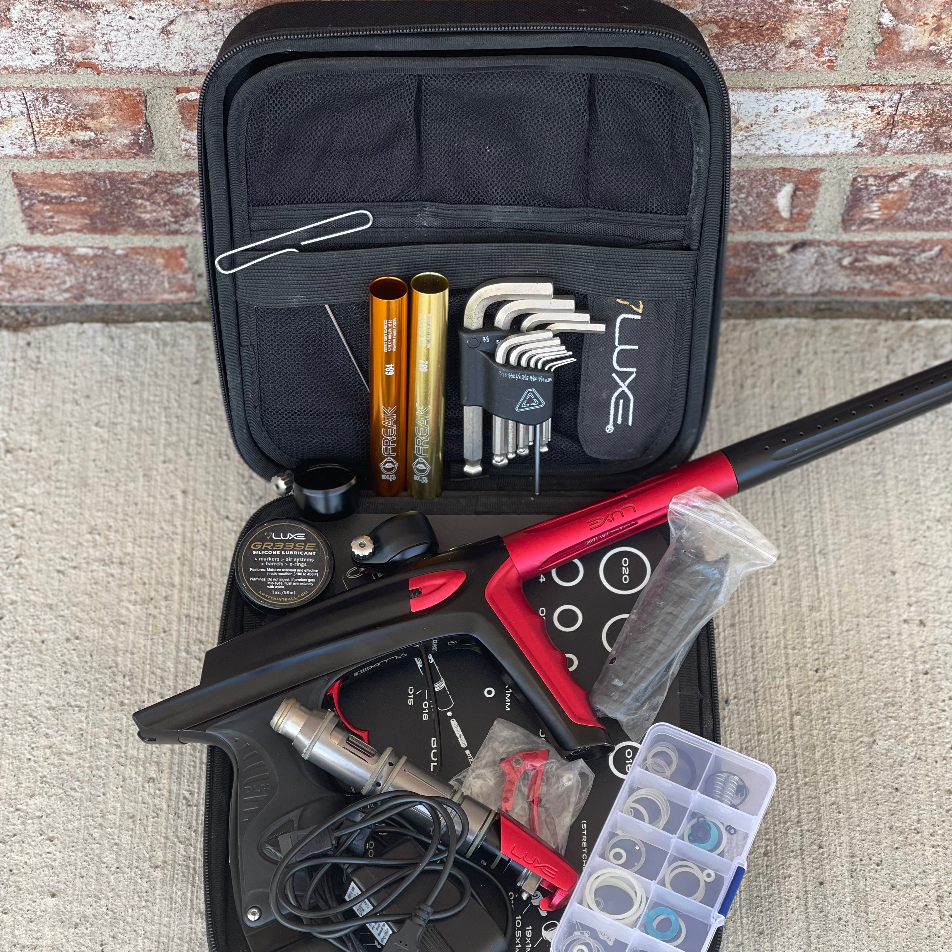 Used DLX Luxe Ice Paintball Gun - Dust Black / Dust Red w/ Infamous Deuce Trigger and 3 Freak Inserts