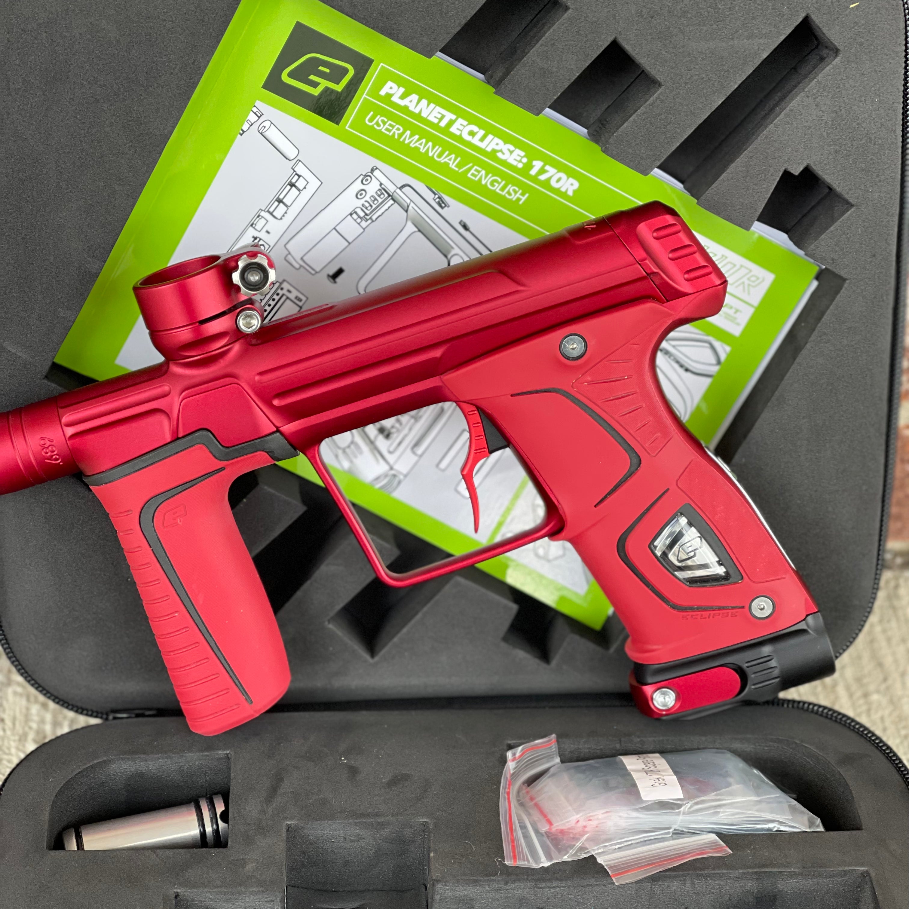 Used Planet Eclipse 170R Paintball Gun - Dust Red w/Red Grip Kit, Deuce Trigger, and ST3 Bolt