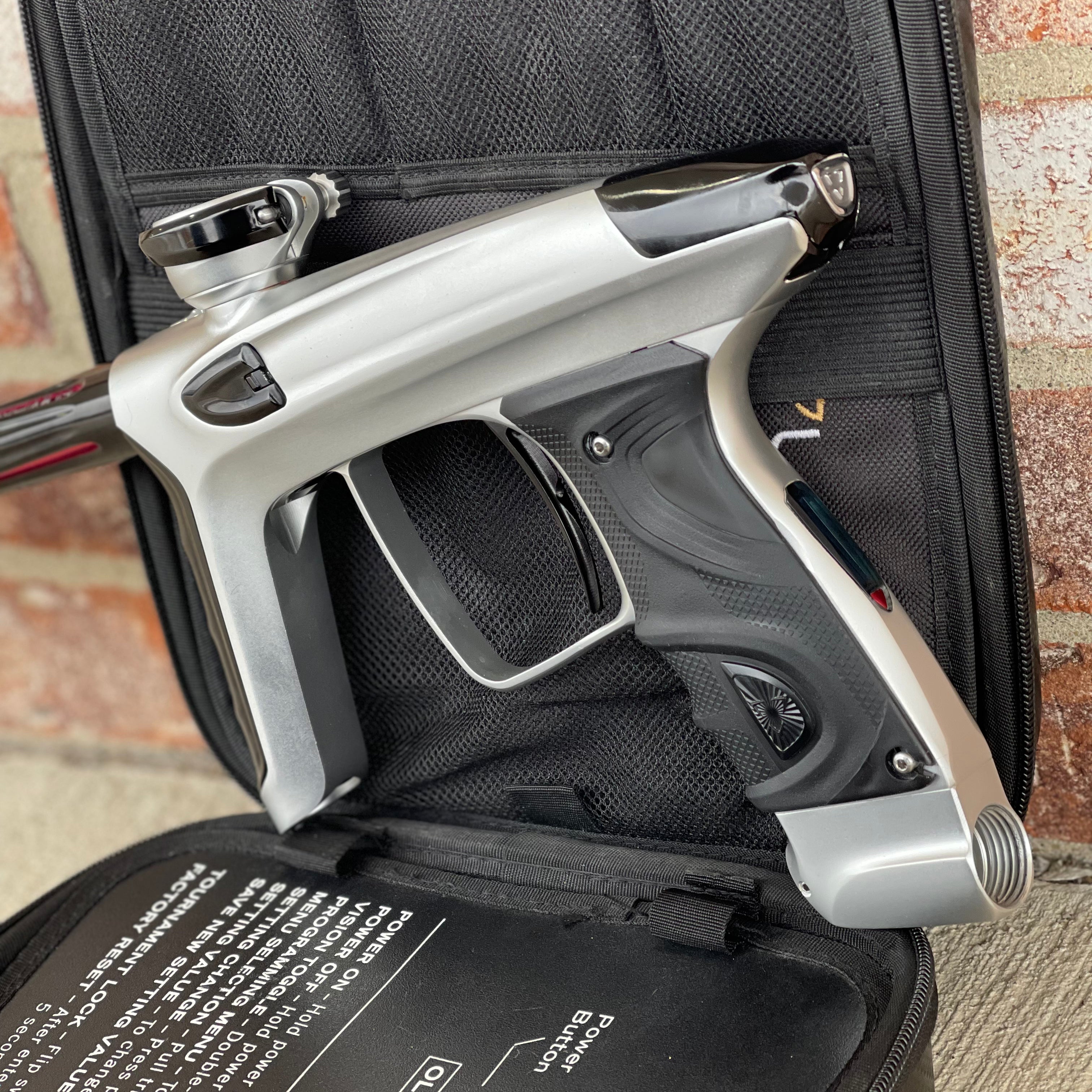 Used DLX Luxe TM40 Paintball Gun - Dust Silver/Gloss Black w/ Stock Bolt and SSC Bolt
