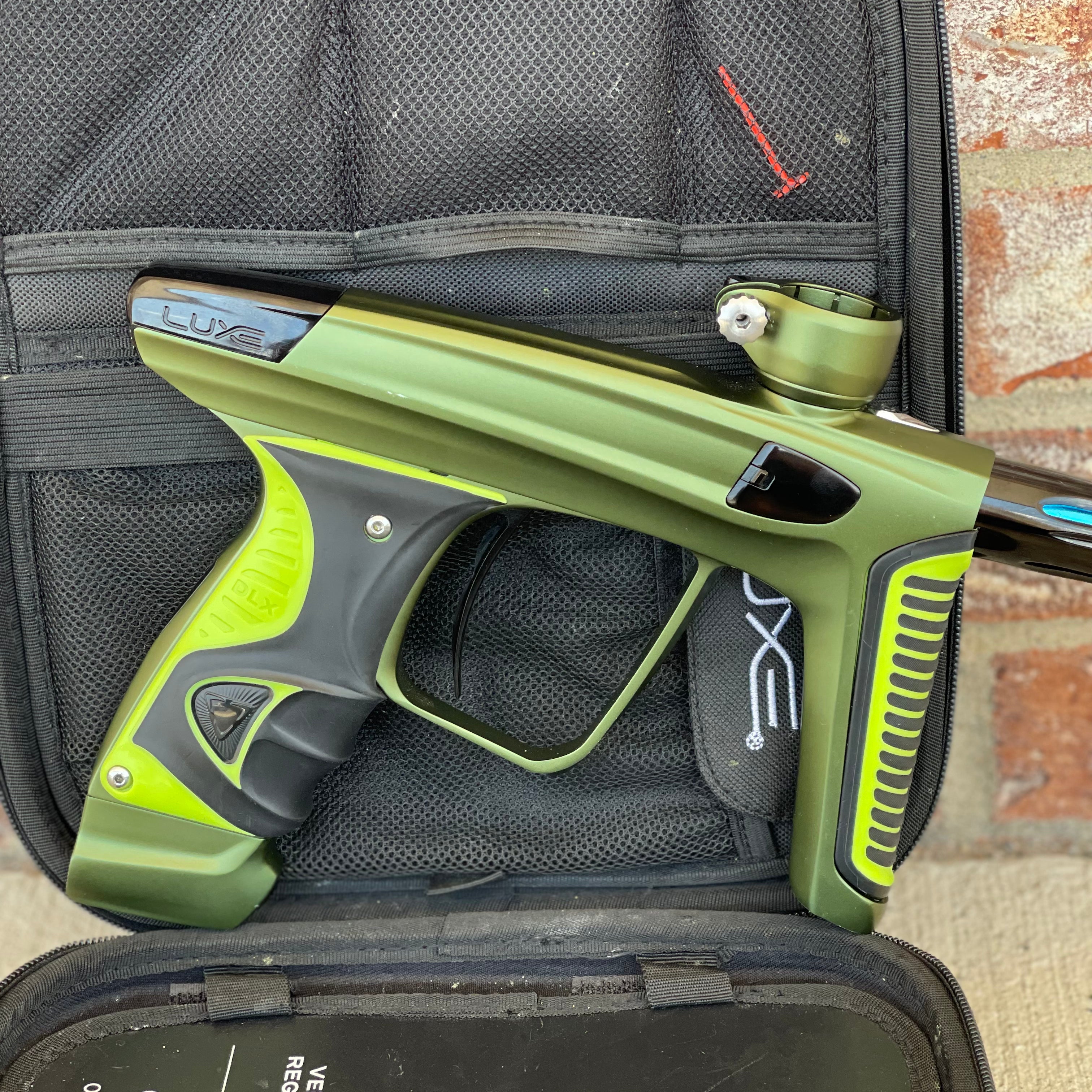 Used DLX Luxe X Paintball Gun - Dust Olive/Polished Black w/ Green Grip Kit