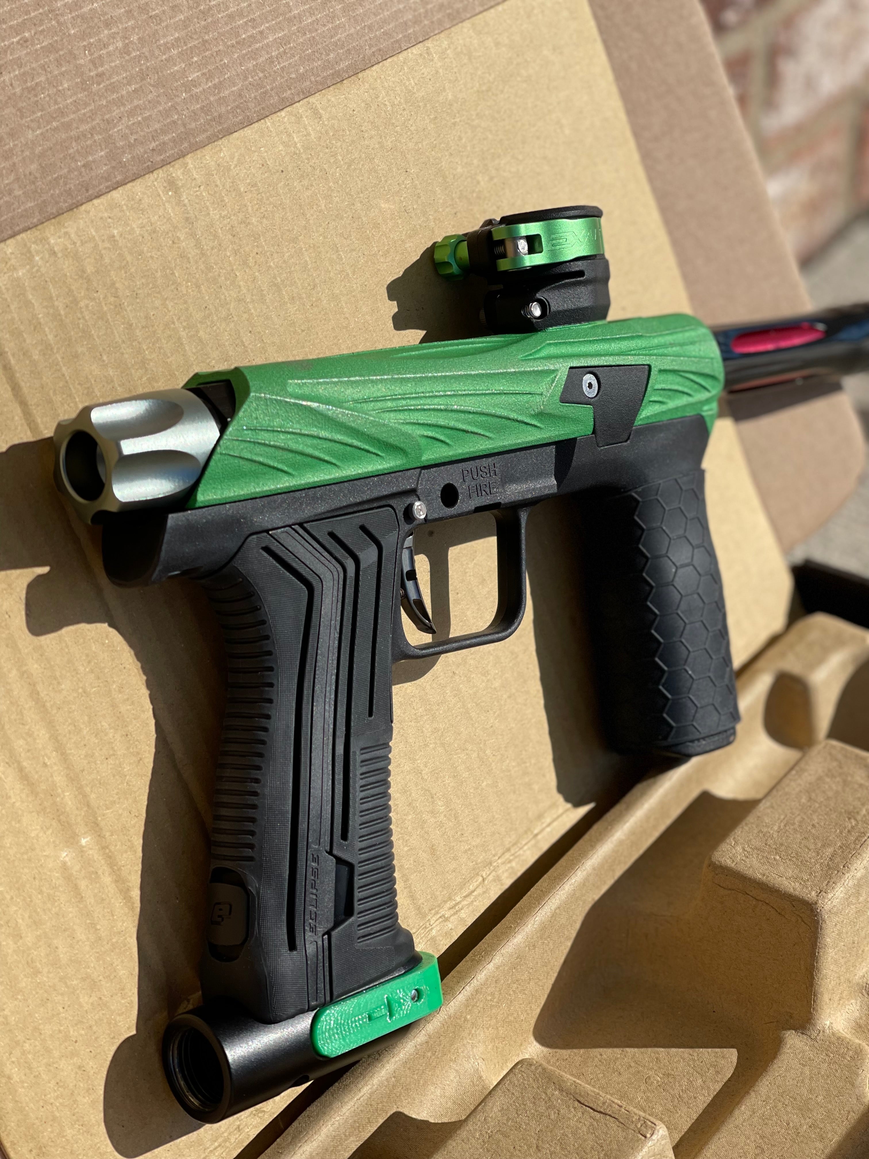 Used Planet Eclipse Emek 100 Paintball Gun - Green - Custom Body w/ Infamous Murder Trigger w/ Freak XL Barrel Kit, Hair 45 Trigger Valve, POPS ASA, Exalt Back Cap, Exalt Feedneck Lever, Rubber Front Grip Sleeve