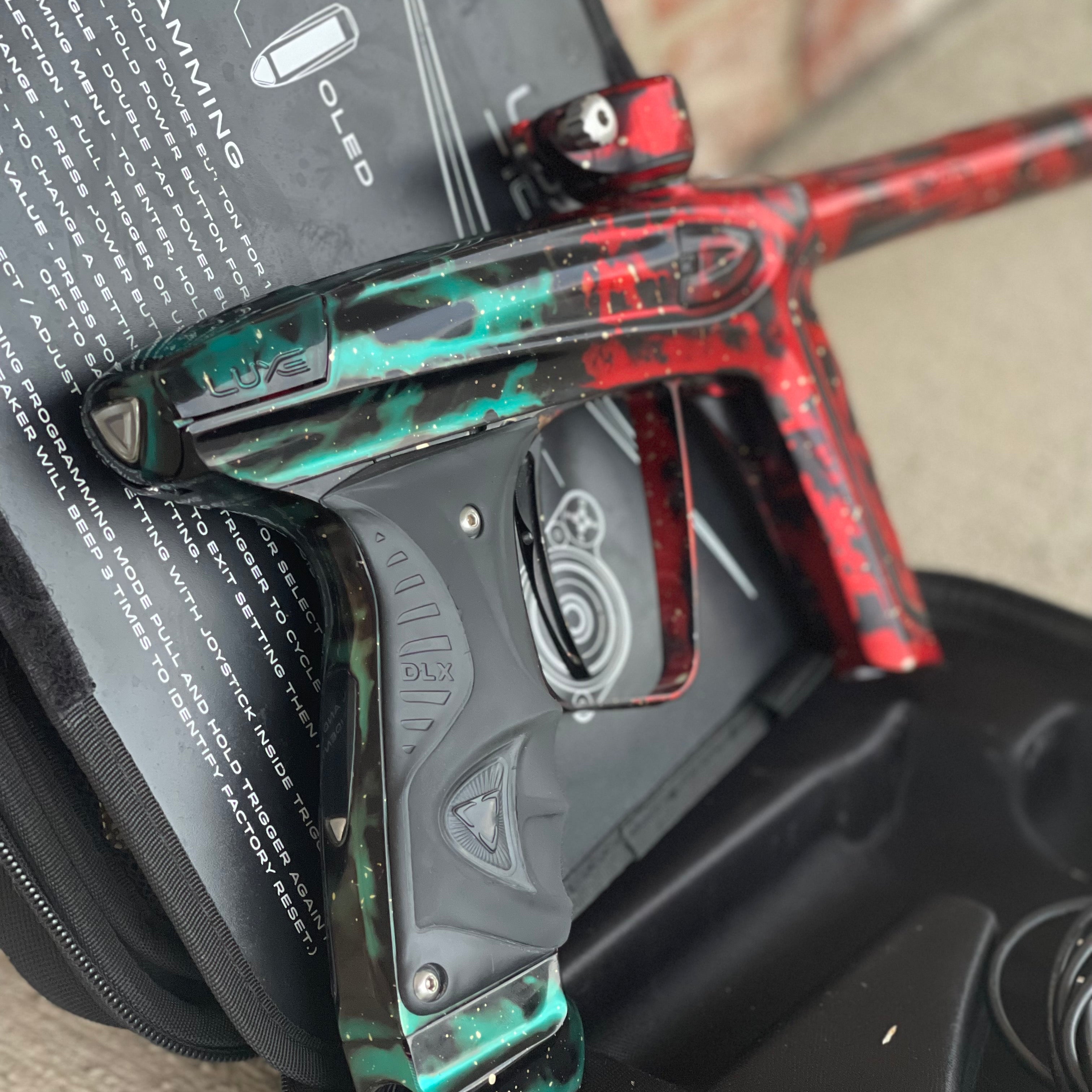 Used DLX Luxe Ice Paintball Gun - Red/Green Galaxy (1 of 15)