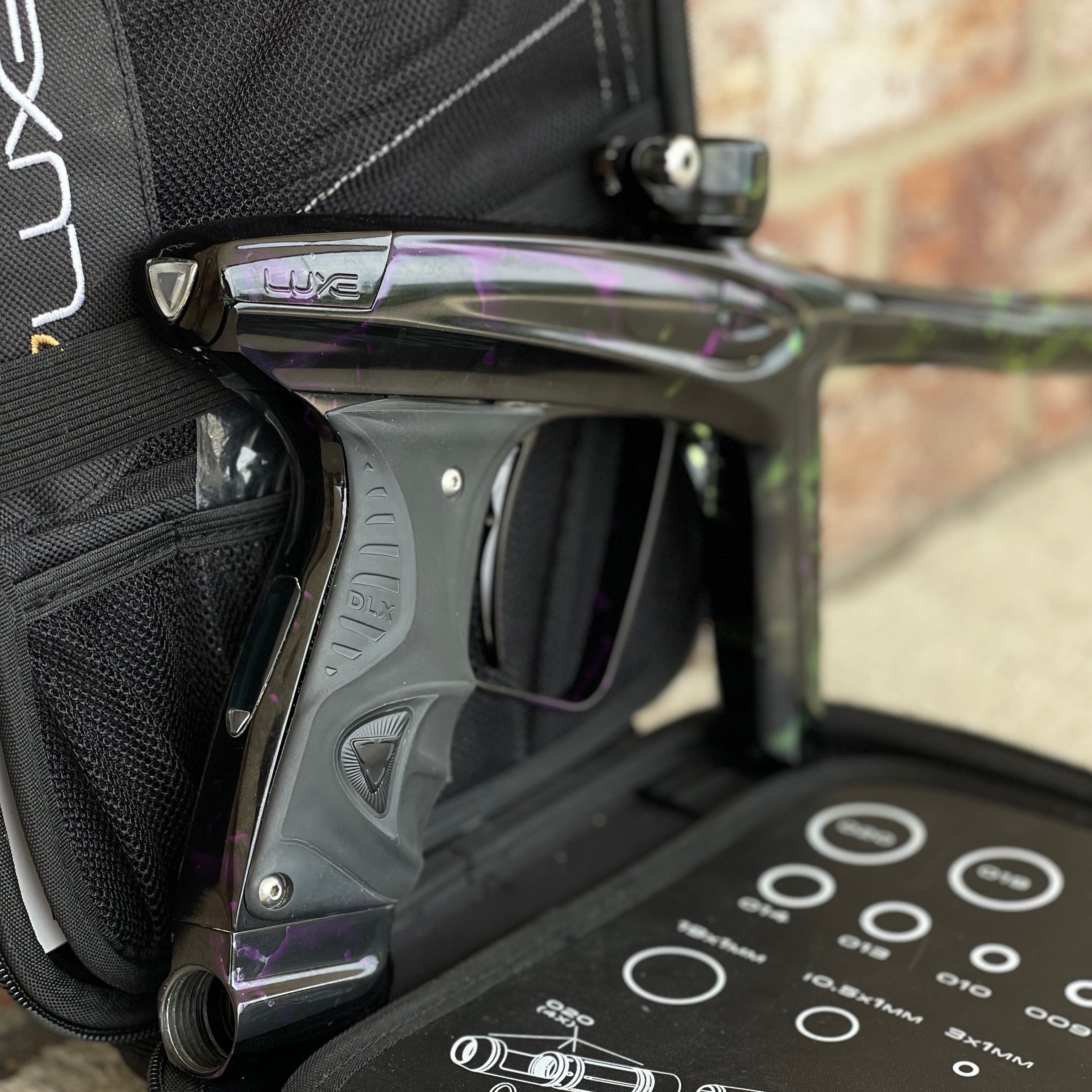 Used DLX Luxe Ice Paintball Gun - Acid Wash Green / Purple