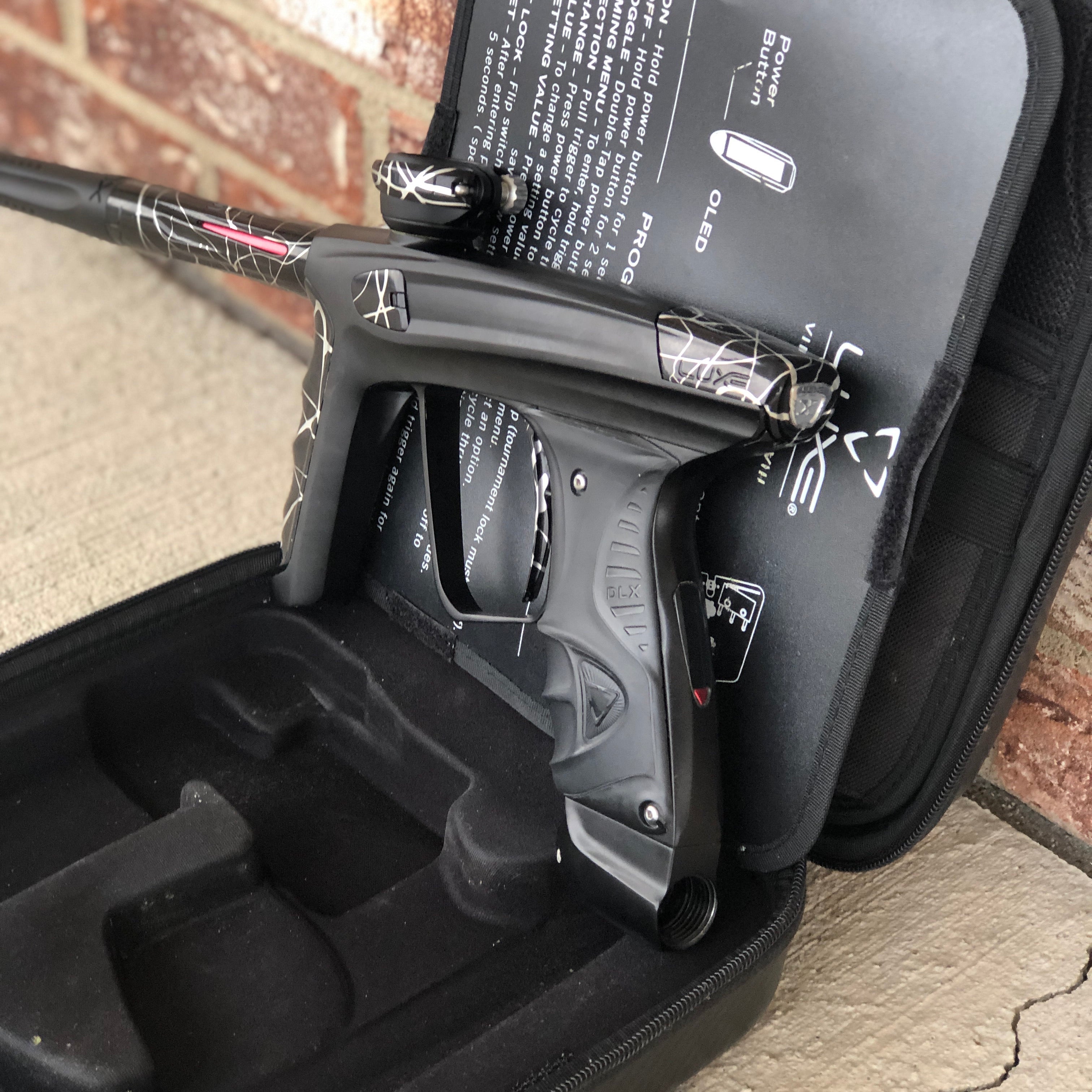 Used DLX Luxe X Paintball Gun - Dust Black w/ Black & Silver Splash Accents