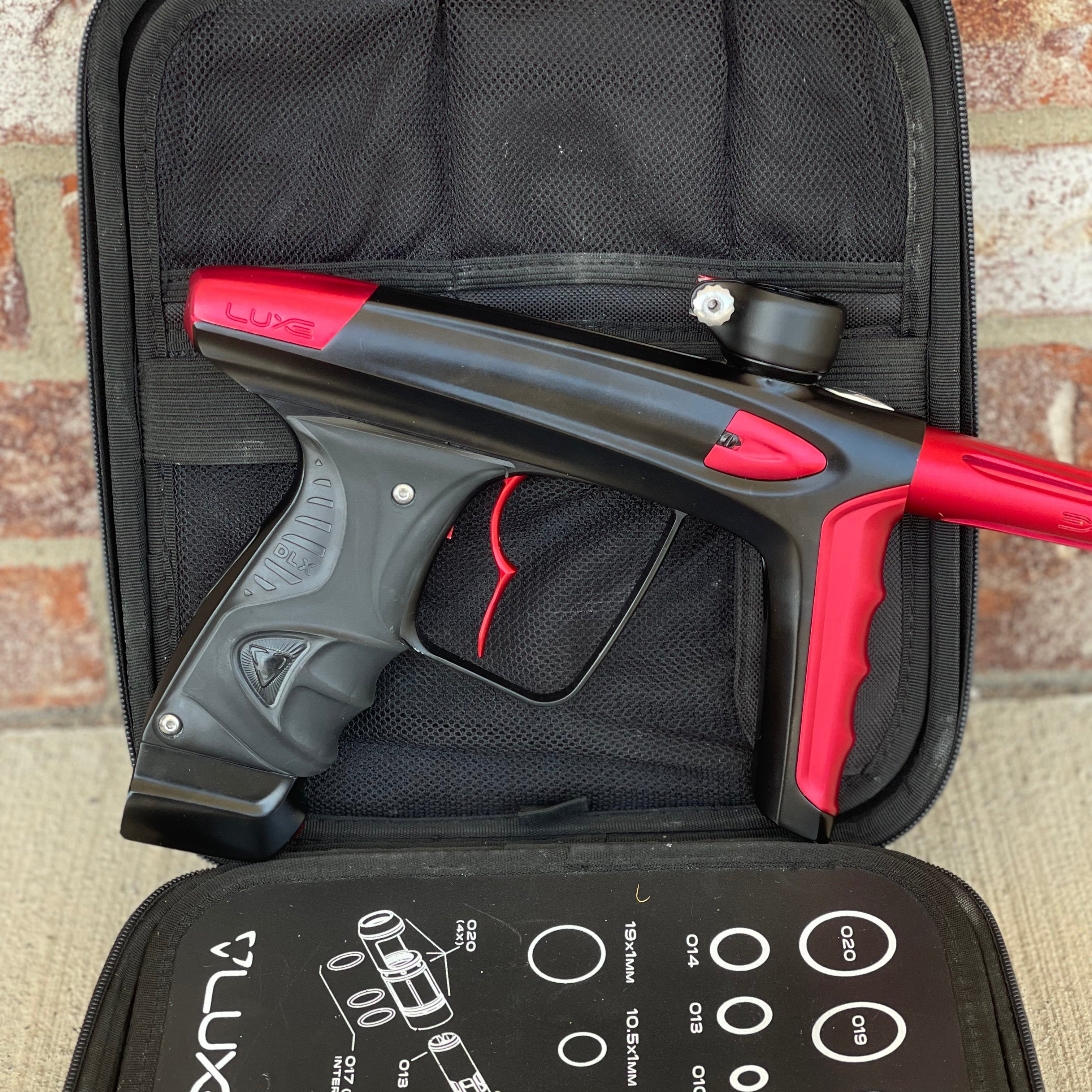 Used DLX Luxe Ice Paintball Gun - Dust Black / Dust Red w/ Infamous Deuce Trigger and 3 Freak Inserts