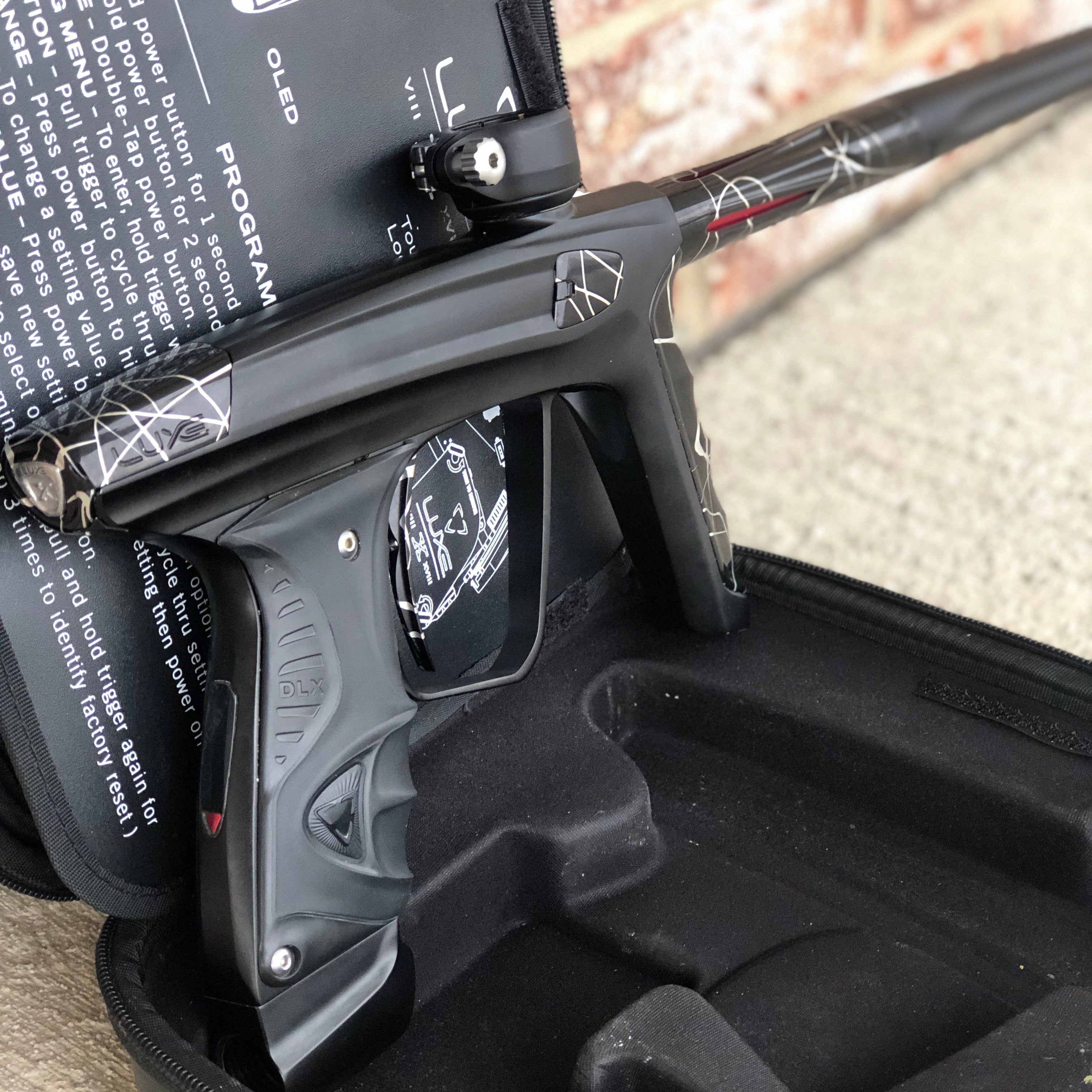 Used DLX Luxe X Paintball Gun - Dust Black w/ Black & Silver Splash Accents