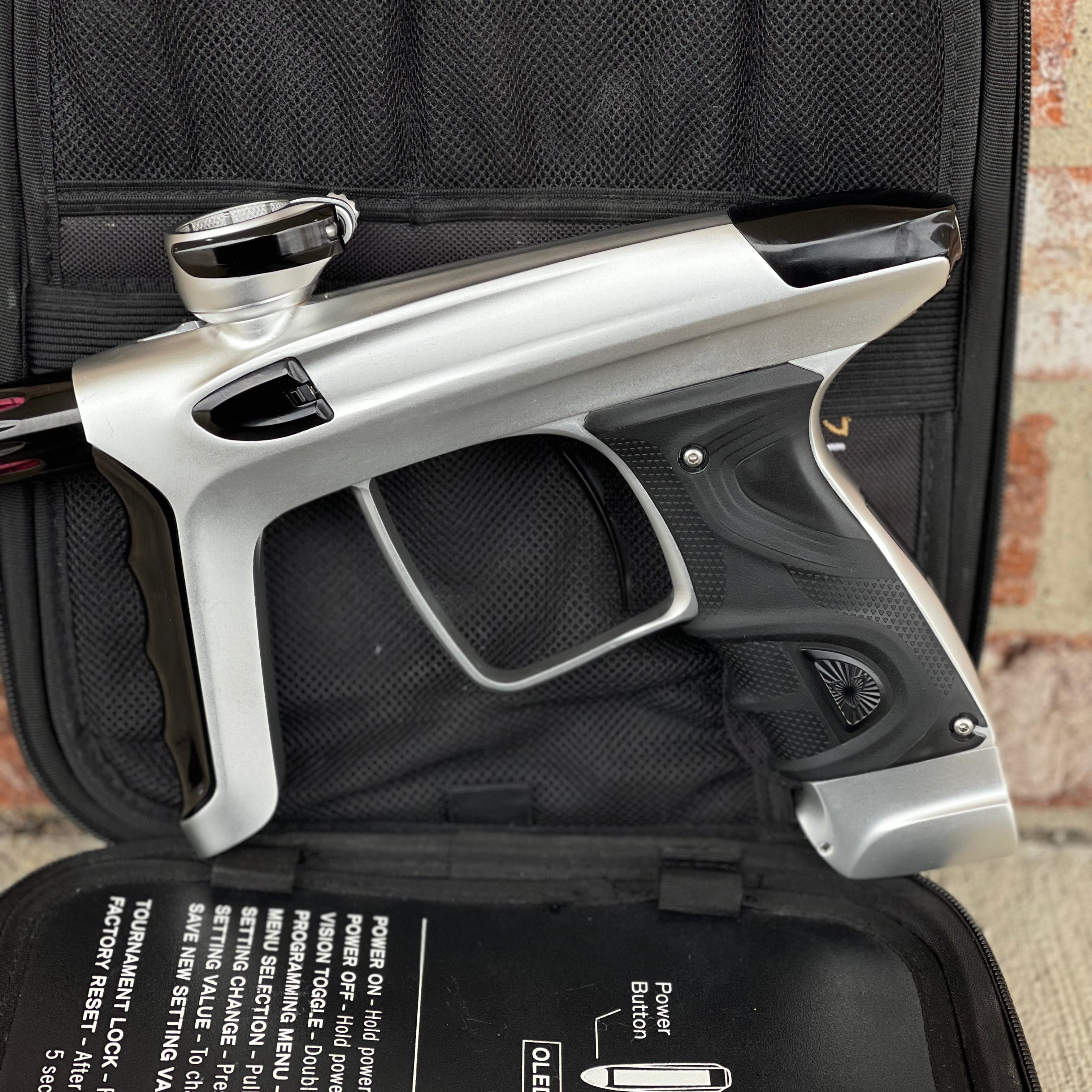 Used DLX Luxe TM40 Paintball Gun - Dust Silver/Gloss Black w/ Stock Bolt and SSC Bolt