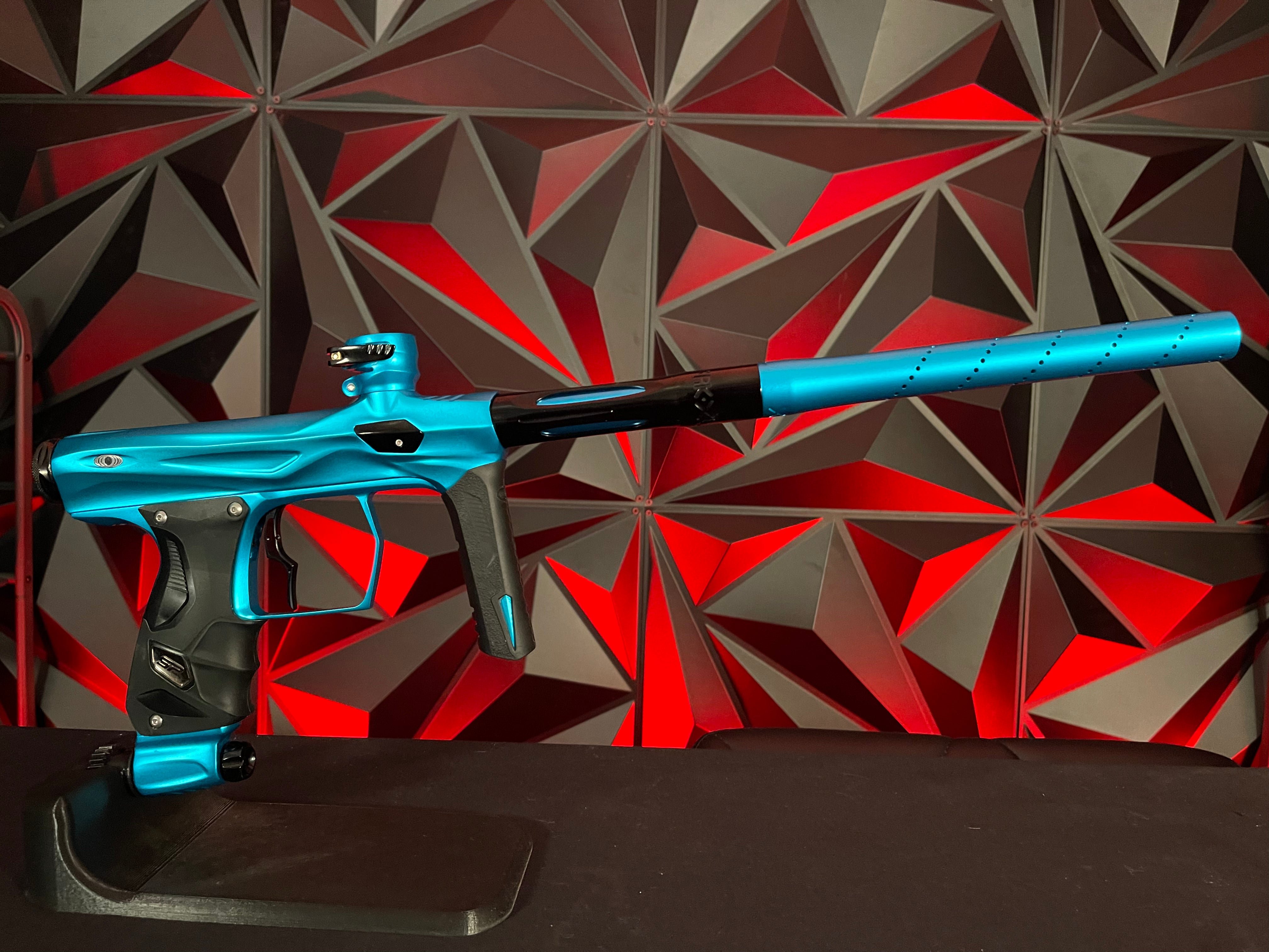 Used Shocker Amp Paintball Gun - Teal w/ Infamous Deuce Trigger