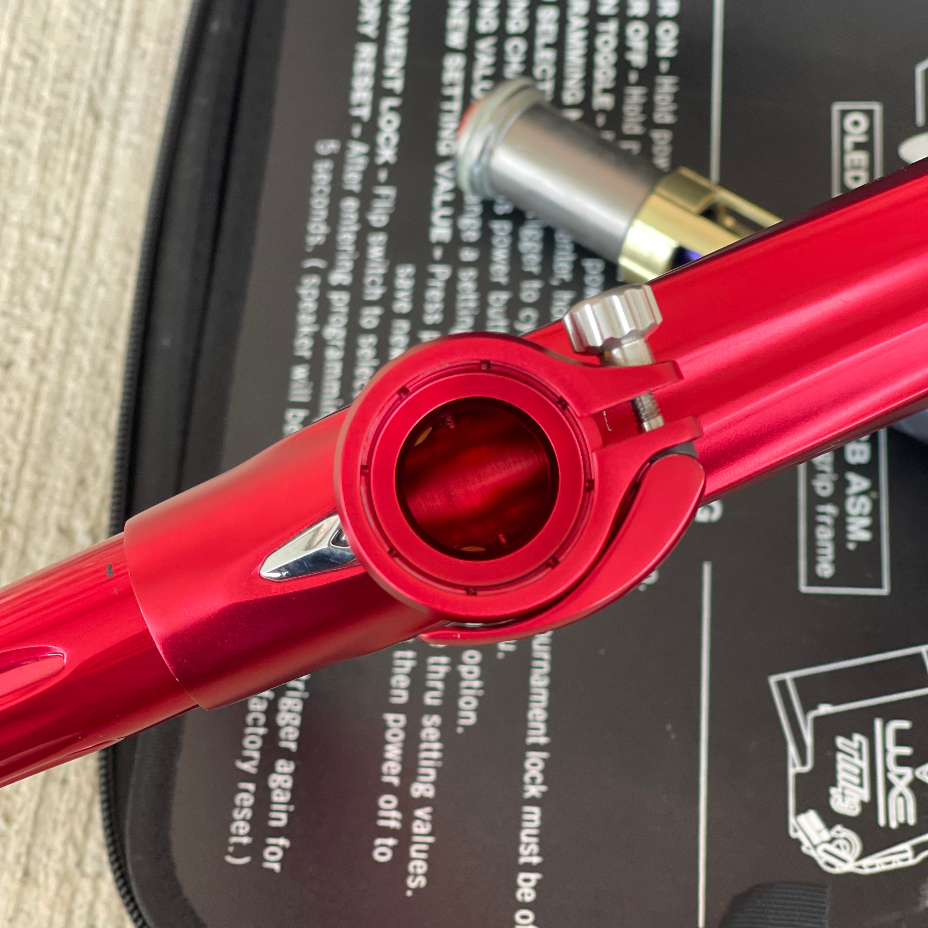 Used DLX Luxe TM40 Paintball Gun - Dust Red / Gloss Red w/ 2 back grips and SSC Soft Tip Bolt