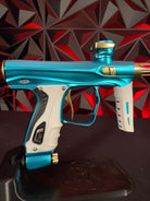 Used Shocker XLS Paintball Gun - Dust Teal / Polished Gold