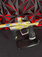 Used Planet Eclipse LV1.1 Paintball Gun - Custom Anno Silver/Yellow Tiger w/Deuce Trigger, TechT Bolt, White & Black Grip Kit