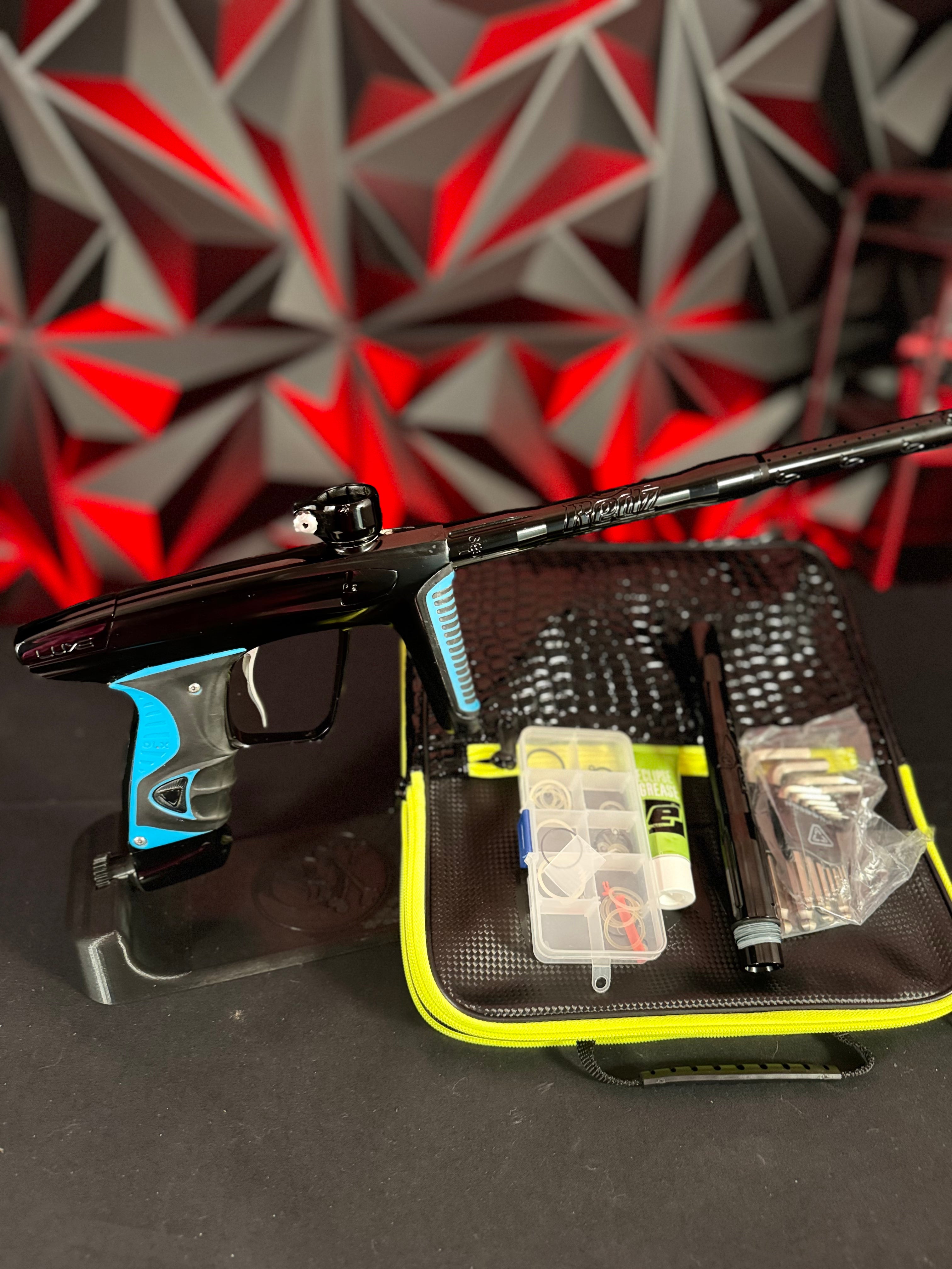 Used DLX Luxe X Paintball Gun - Black w/ Blue Grips