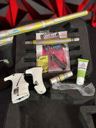 Used Planet Eclipse LV1.1 Paintball Gun - Custom Anno Silver/Yellow Tiger w/Deuce Trigger, TechT Bolt, White & Black Grip Kit