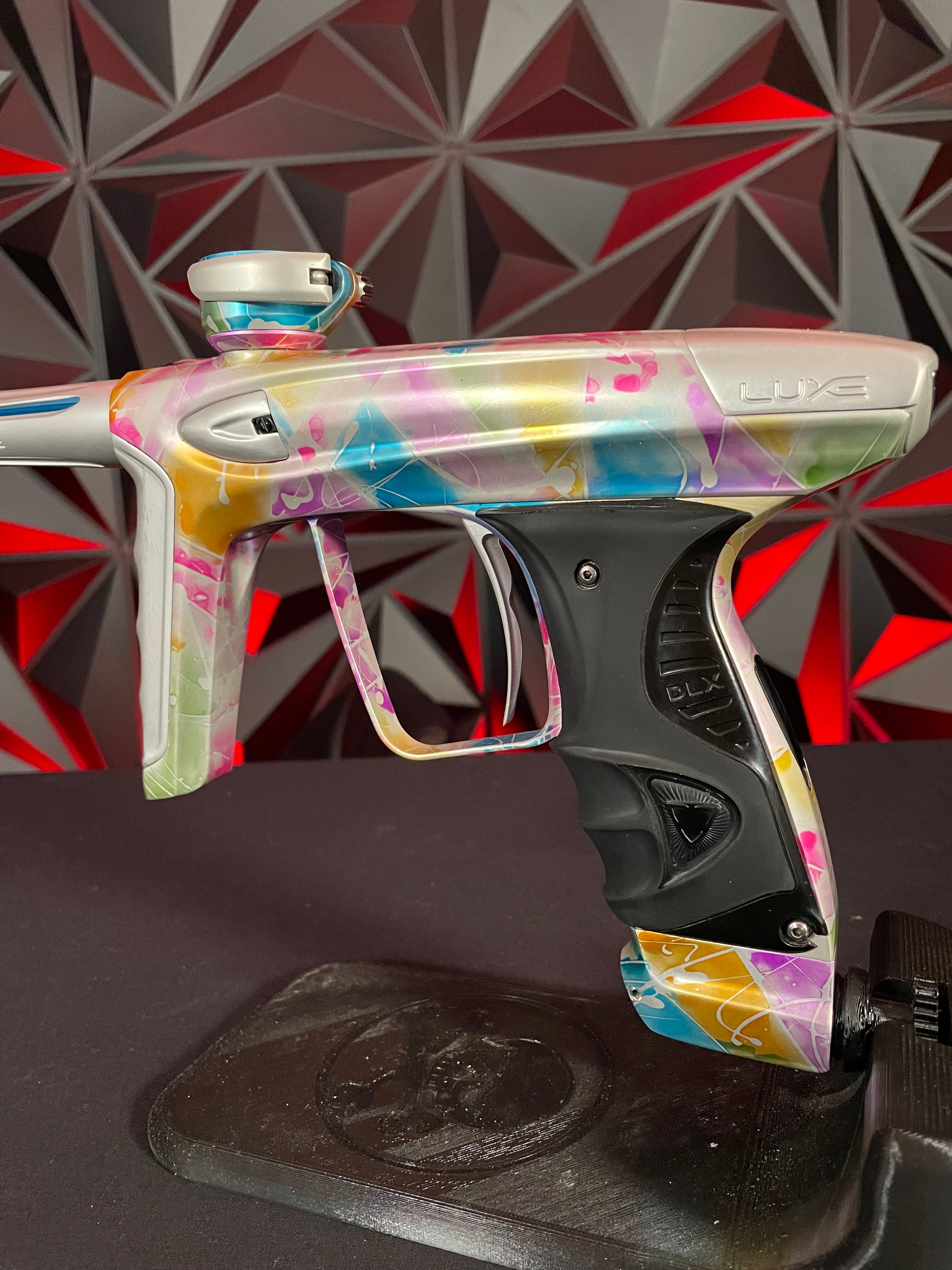 Used DLX Luxe ICE Paintball Gun - Multi-Color Splash w/ 4 Freak Insert