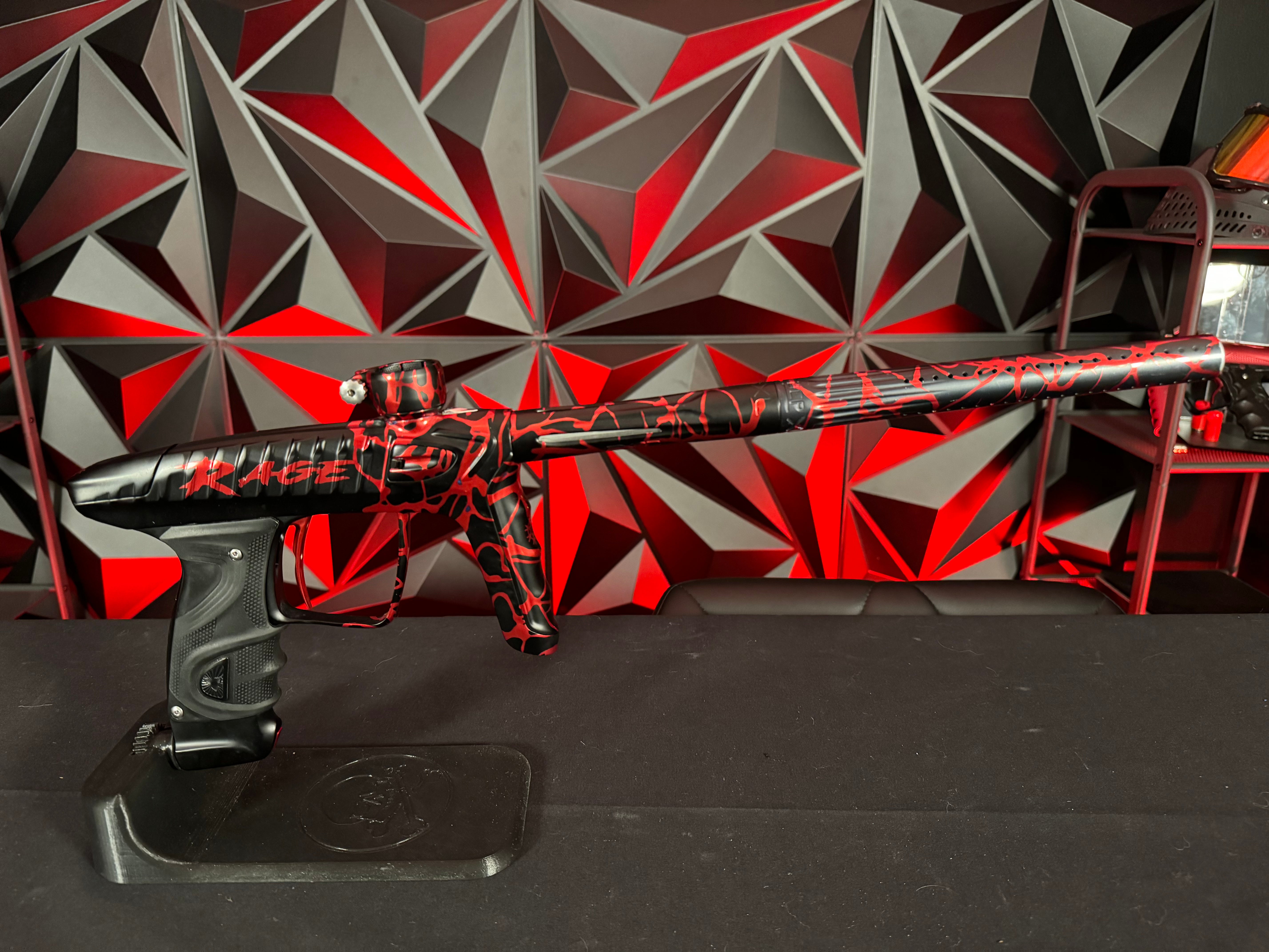 Used DLX LUXE "Project" TM40 Paintball Gun - Rage Black/Red Splash