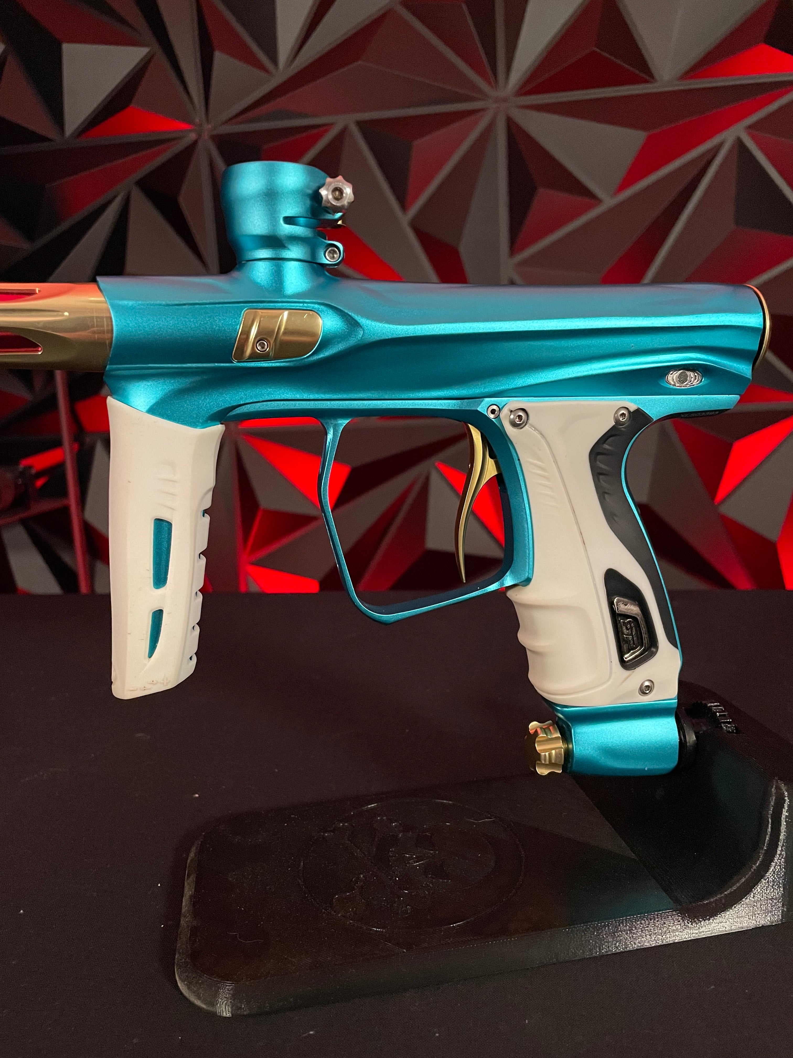 Used Shocker XLS Paintball Gun - Dust Teal / Polished Gold