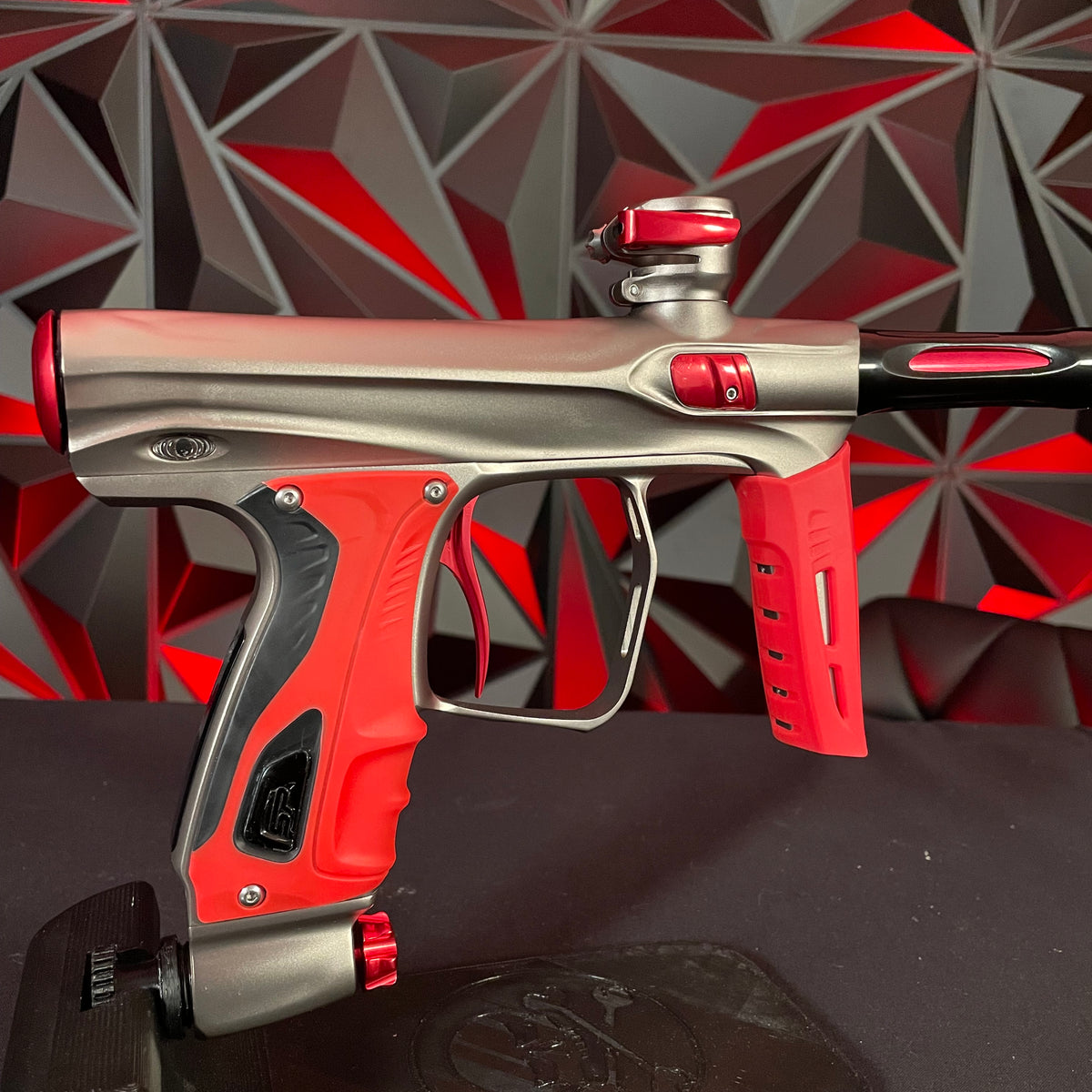 Used Shocker XLS Paintball Gun - Pewter/Red w/ Red Grip Kit