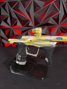 Used Planet Eclipse LV1.1 Paintball Gun - Custom Anno Silver/Yellow Tiger w/Deuce Trigger, TechT Bolt, White & Black Grip Kit