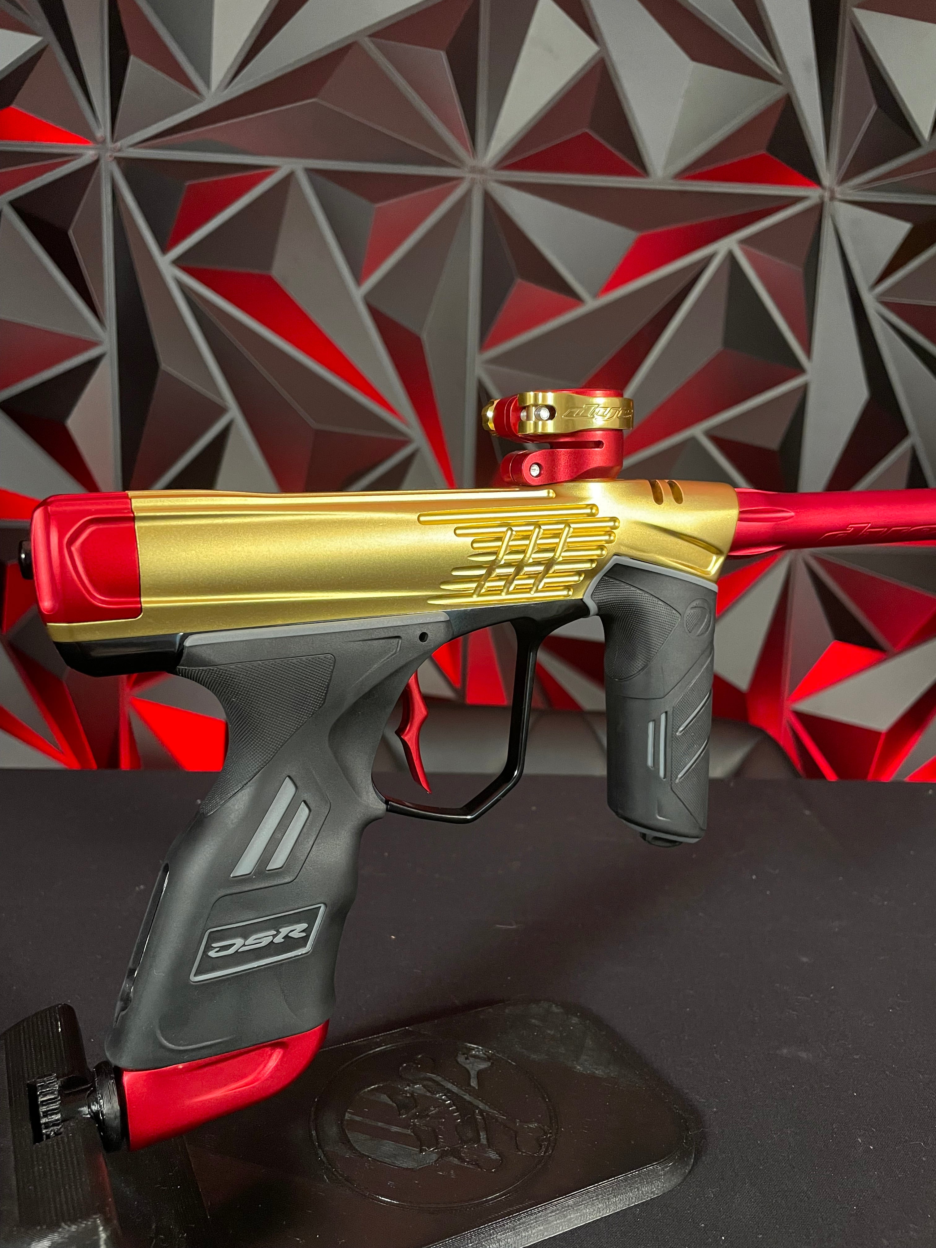 Used Dye DSR+ Paintball Gun - ICON Edition Gold/Red w/ IM Pro Kit