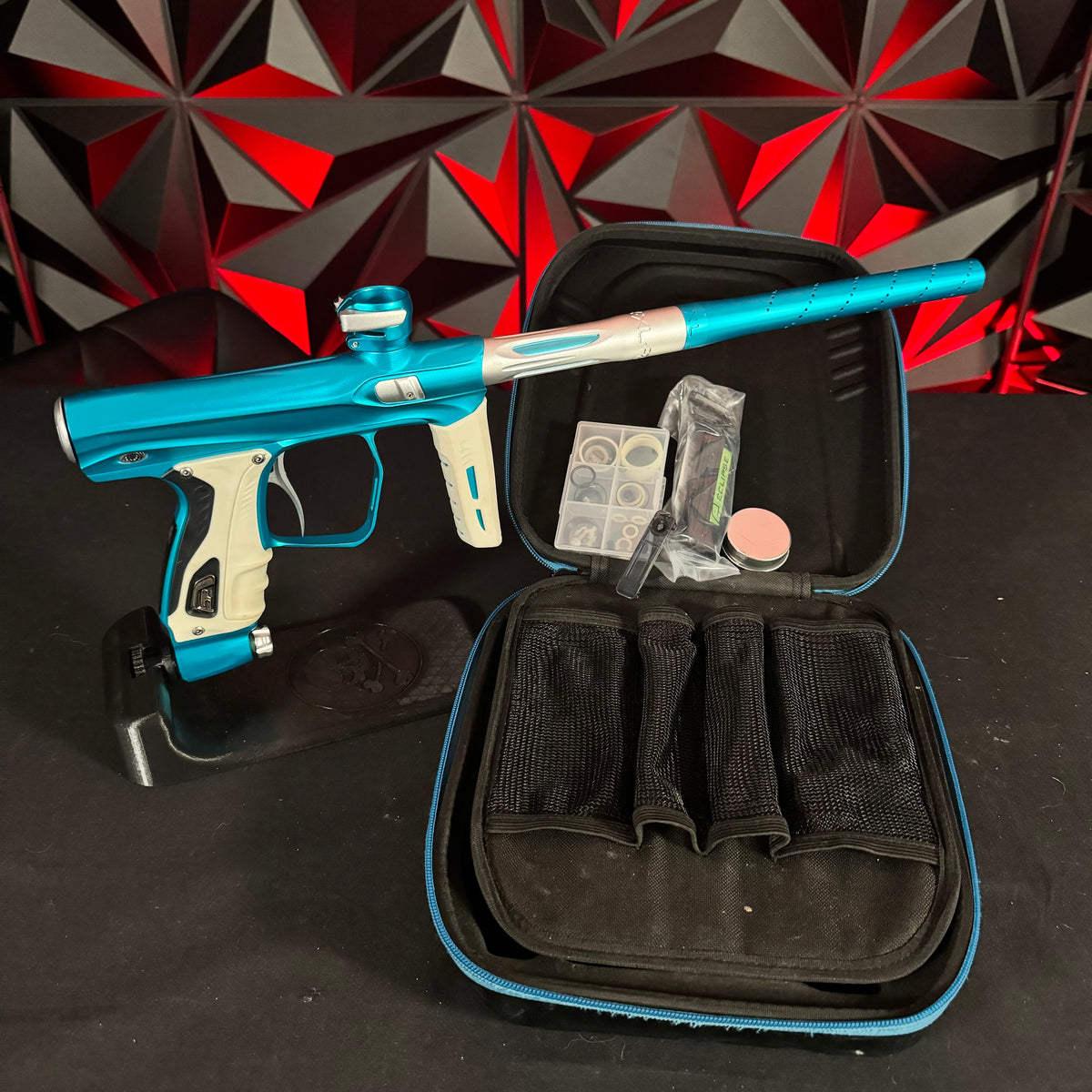 Used Shocker XLS Paintball Gun - Teal/Silver w/White Grip Kit
