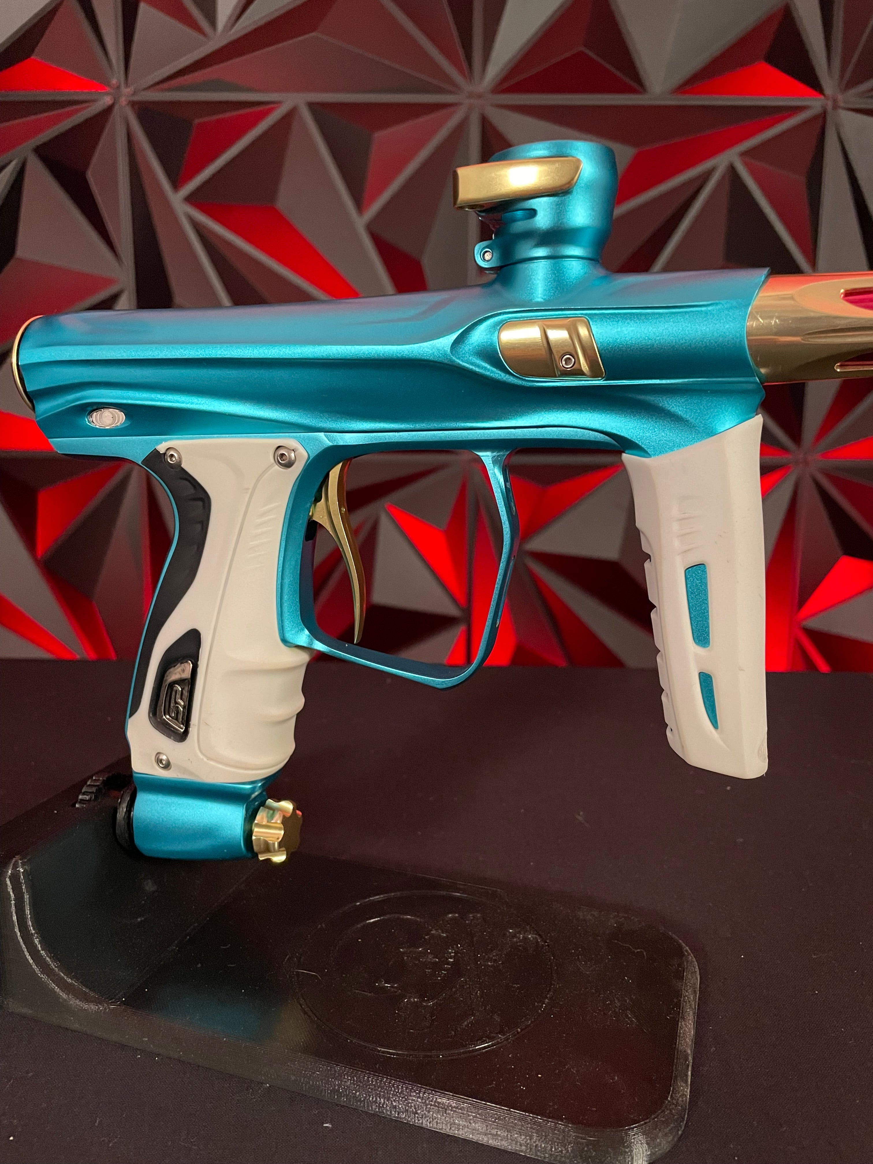 Used Shocker XLS Paintball Gun - Dust Teal / Polished Gold