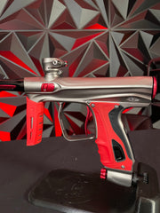 Used Shocker XLS Paintball Gun - Pewter/Red w/ Red Grip Kit