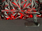 Used DLX LUXE "Project" TM40 Paintball Gun - Rage Black/Red Splash