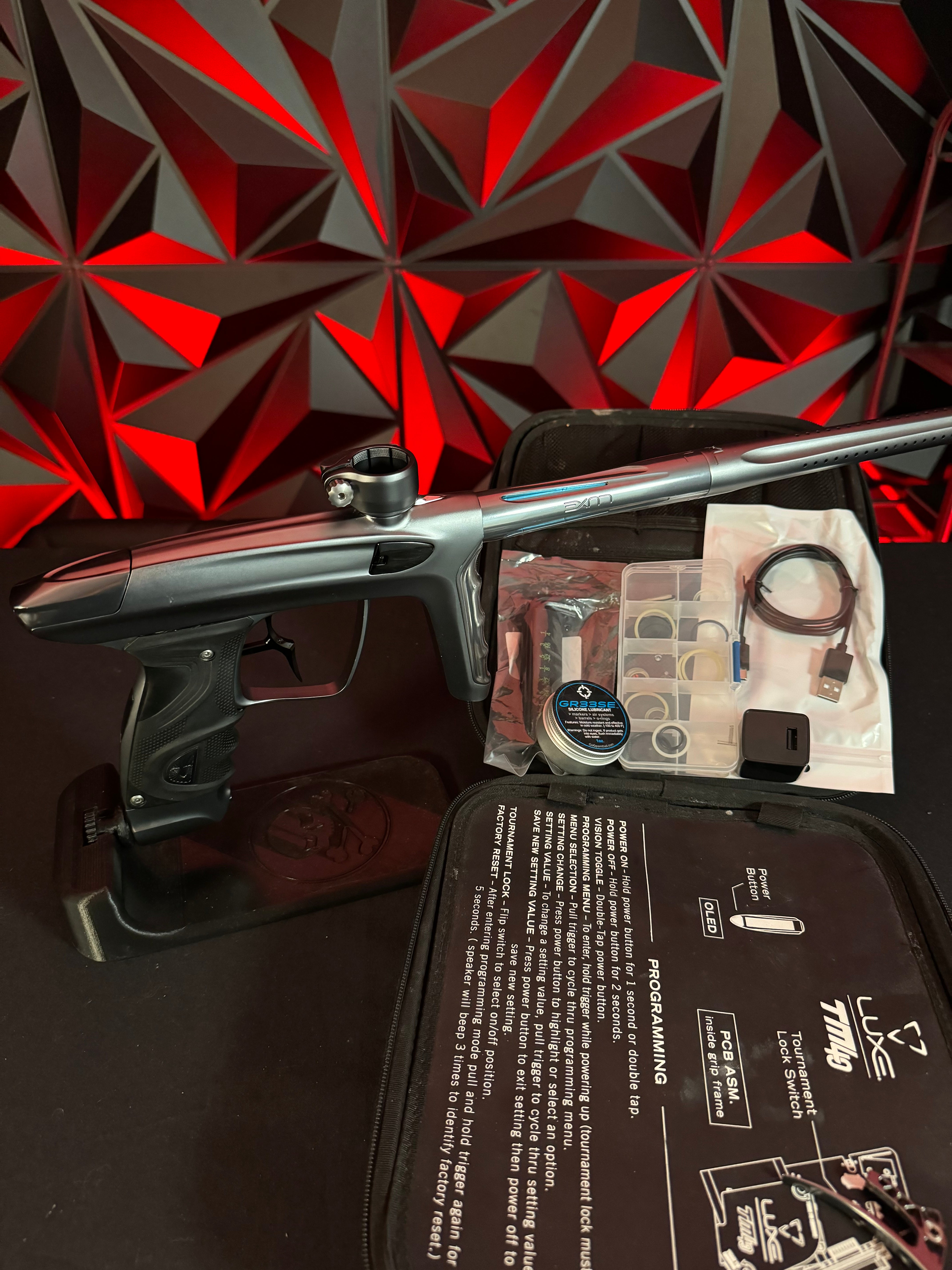 Used DLX TM40 Paintball Gun - Polished Pewter/Dust Pewter w/Infamous Deuce Trigger *Right side eye cover is Polished Black*