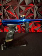 Used Dye DSR+ Paintball Gun - Polished Blue/Polished Gold w/ IM Pro Kit