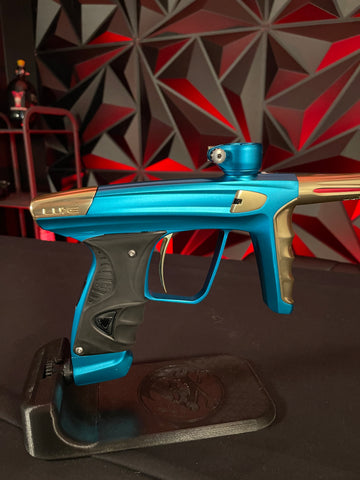 Used DLX Luxe X Paintball Gun - Dust Teal / Polished Gold