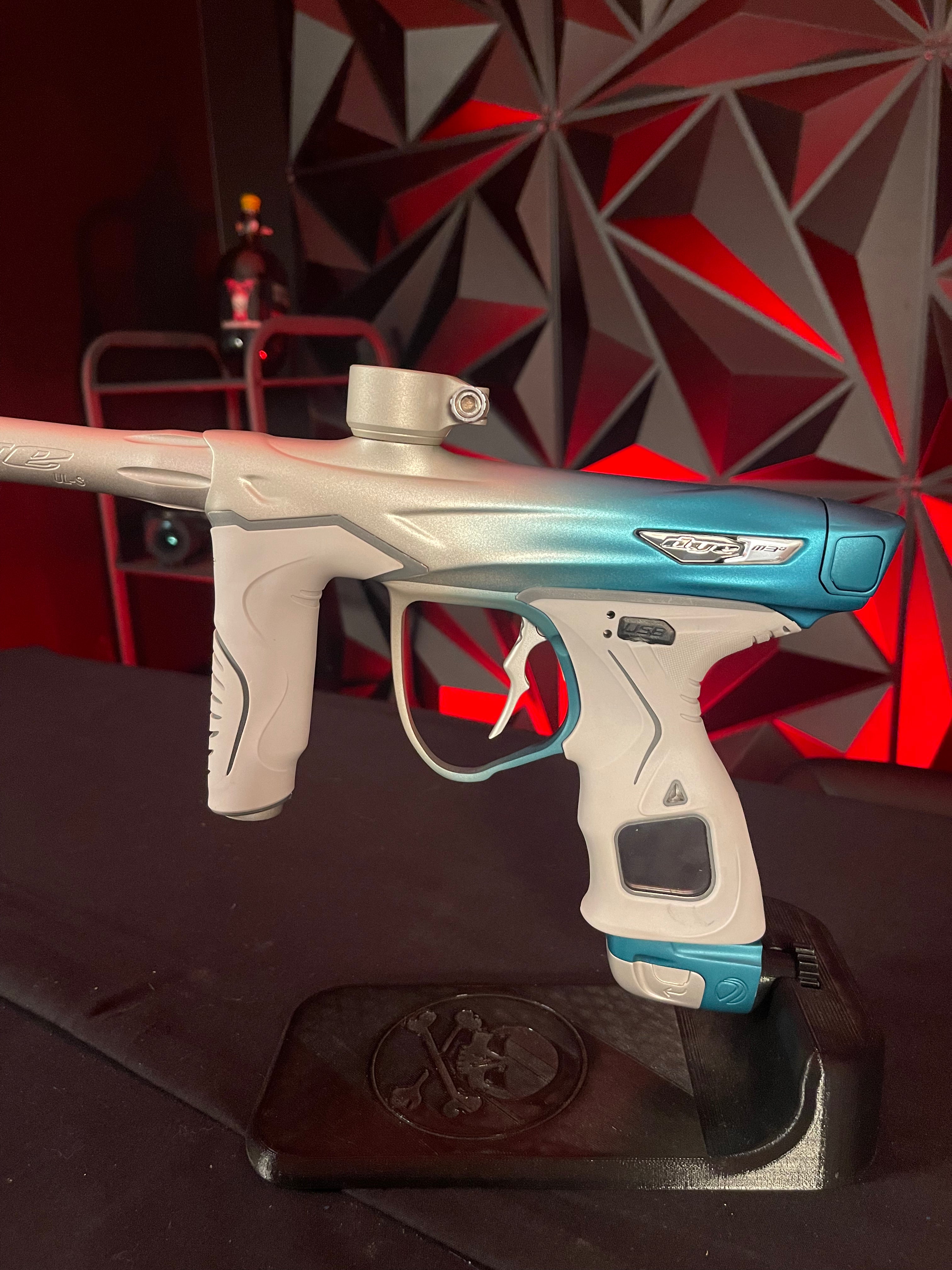 Used Dye M3+ Paintball Gun - Custom Blue to Silver Fade w/ Wireless Charging Pad