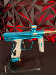 Used Shocker XLS Paintball Gun - Dust Teal / Polished Gold