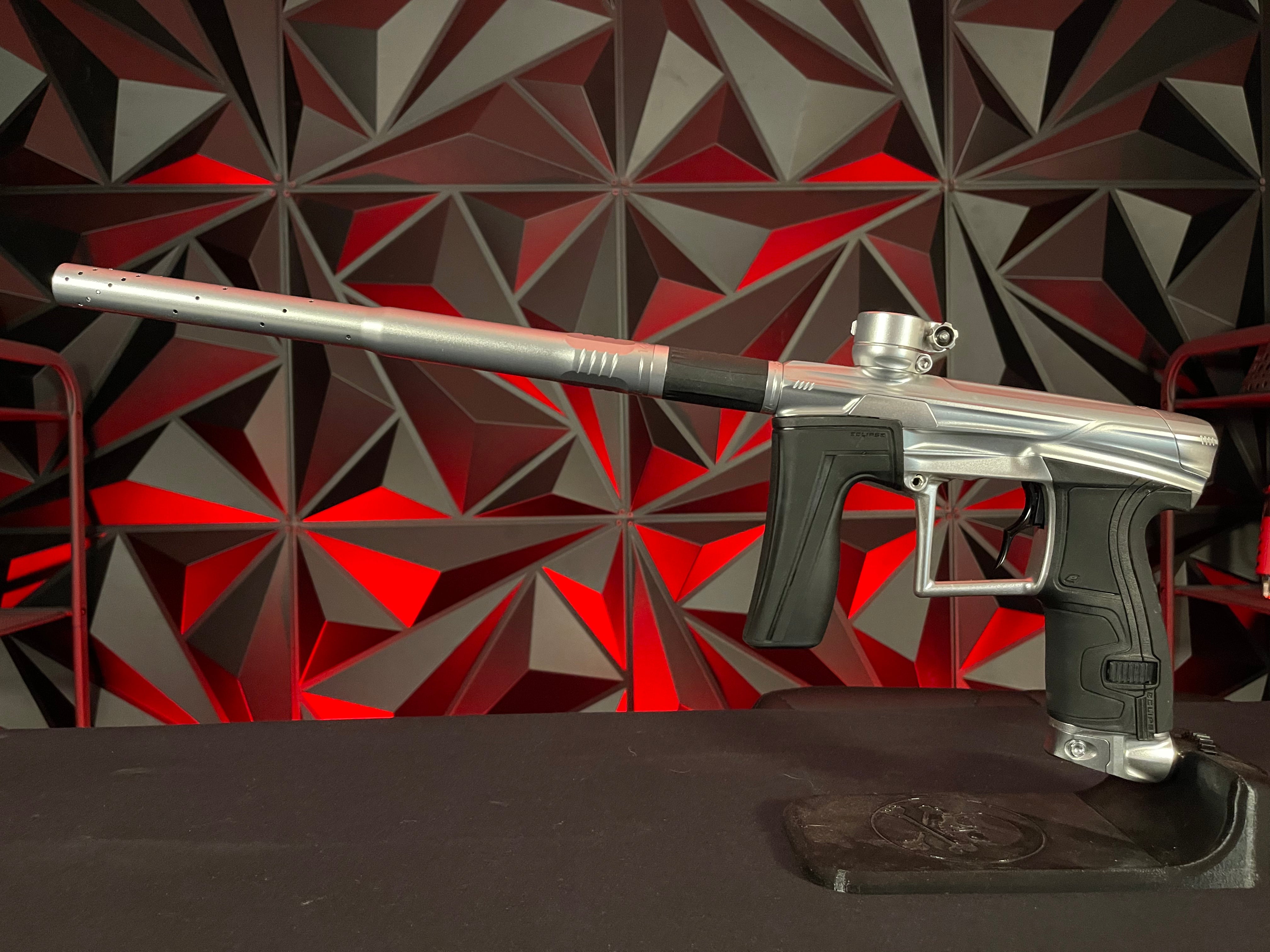 Used Planet Eclipse Geo 4 Paintball Gun - Pure Silver w/ 1 FL Insert and Infamous Deuce Trigger