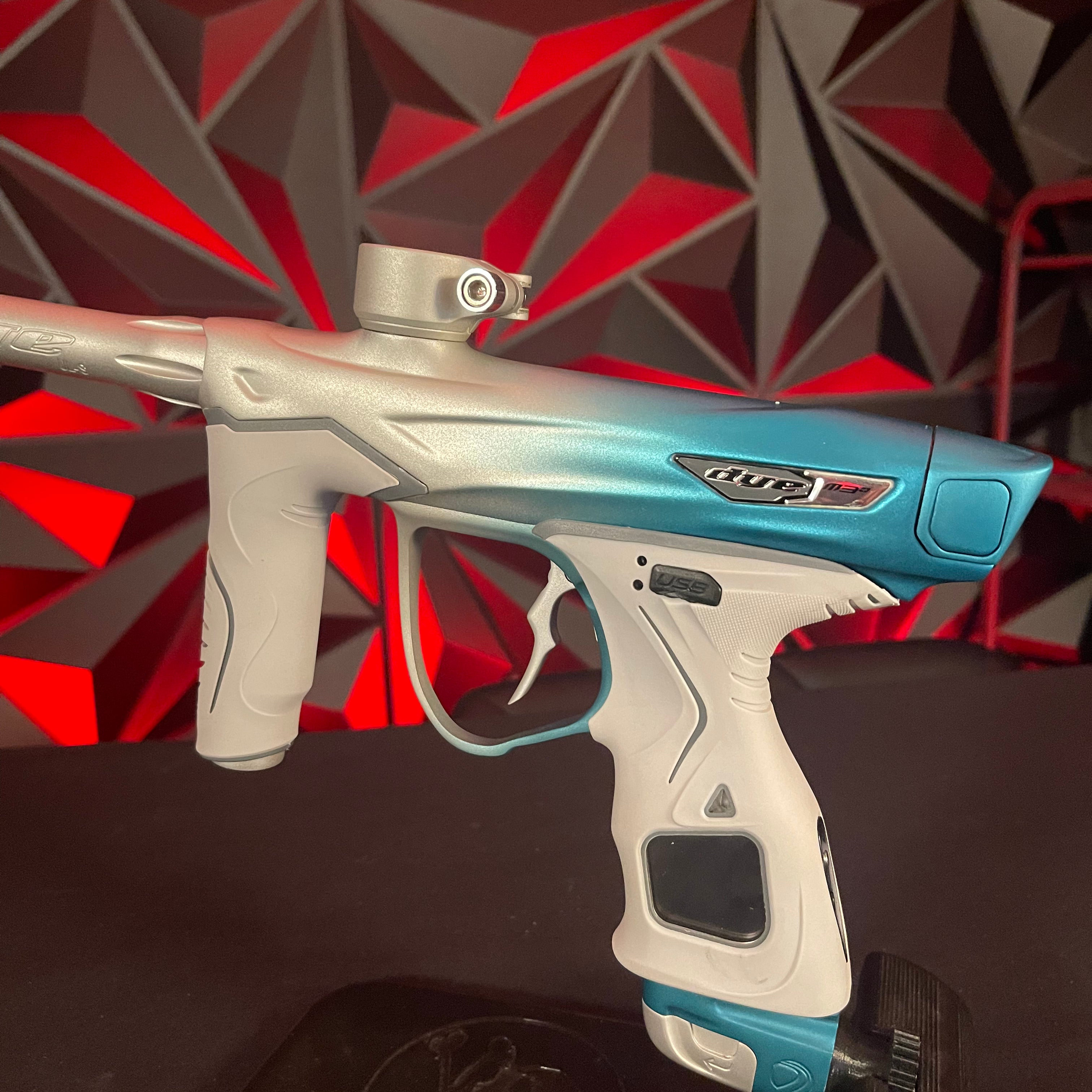 Used Dye M3+ Paintball Gun - Custom Blue to Silver Fade w/ Wireless Charging Pad