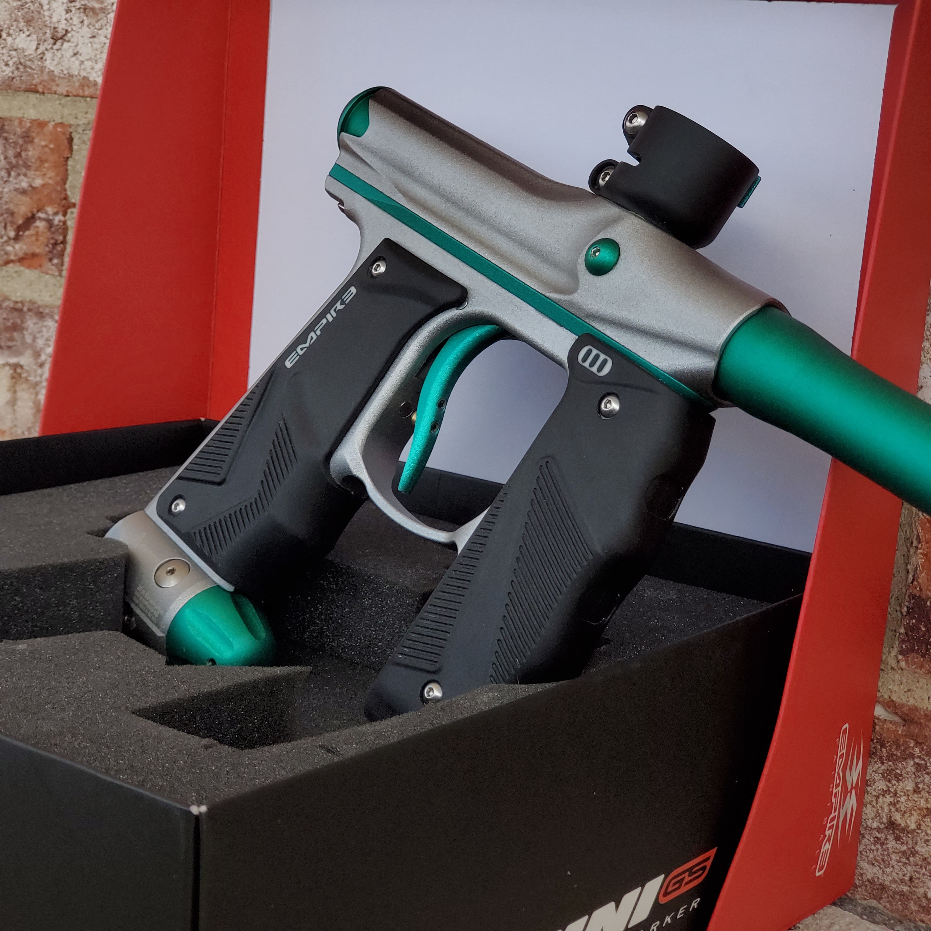 Used Empire Mini GS Paintball Gun- Silver / Aquamarine