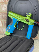 Used Shocker Amp Paintball Gun - Green/Black with Infamous Deuce Trigger and Blue Grips