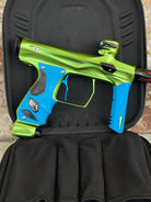 Used Shocker Amp Paintball Gun - Green/Black with Infamous Deuce Trigger and Blue Grips