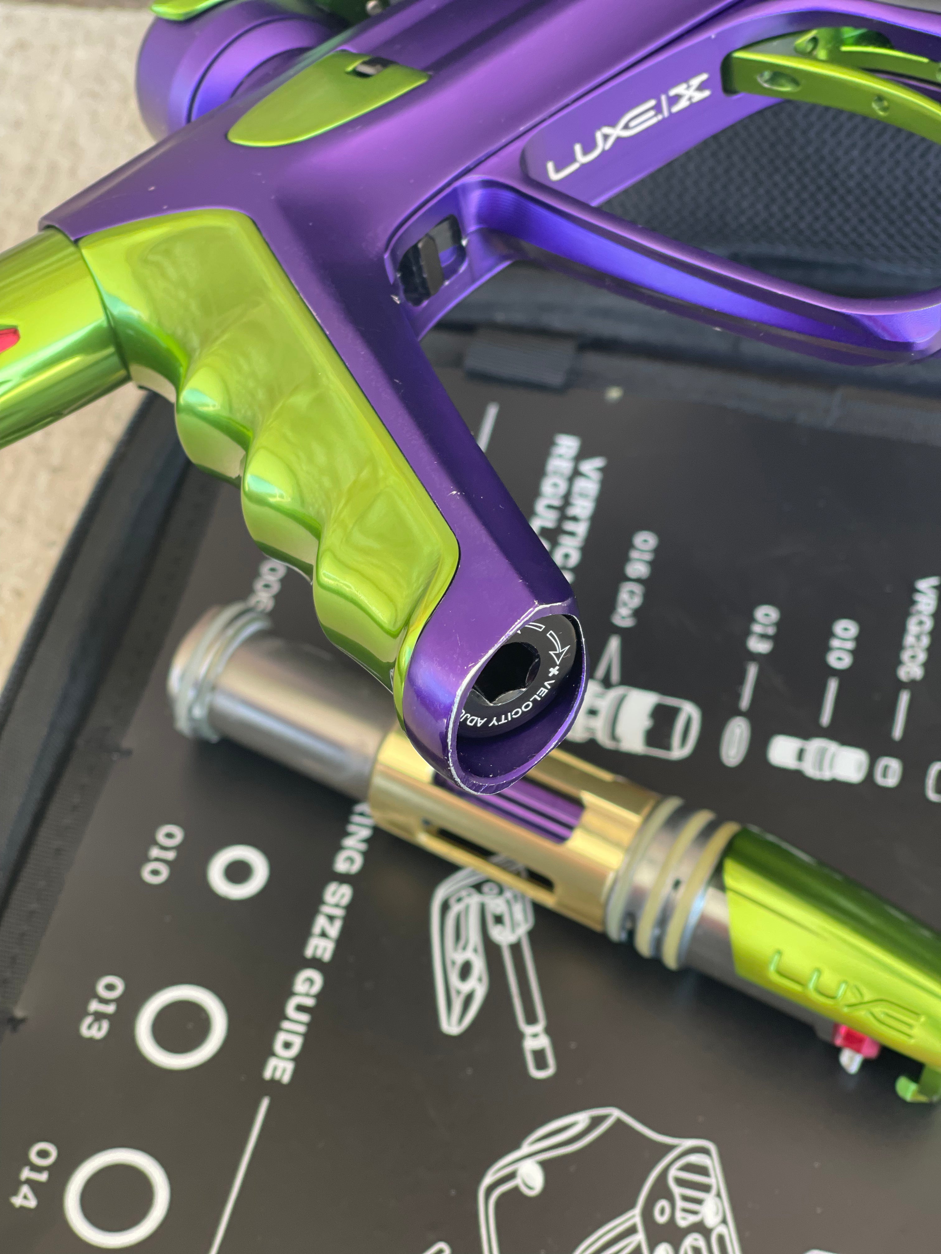 Used DLX Luxe X Paintball Gun - Dust Purple / Polished Green