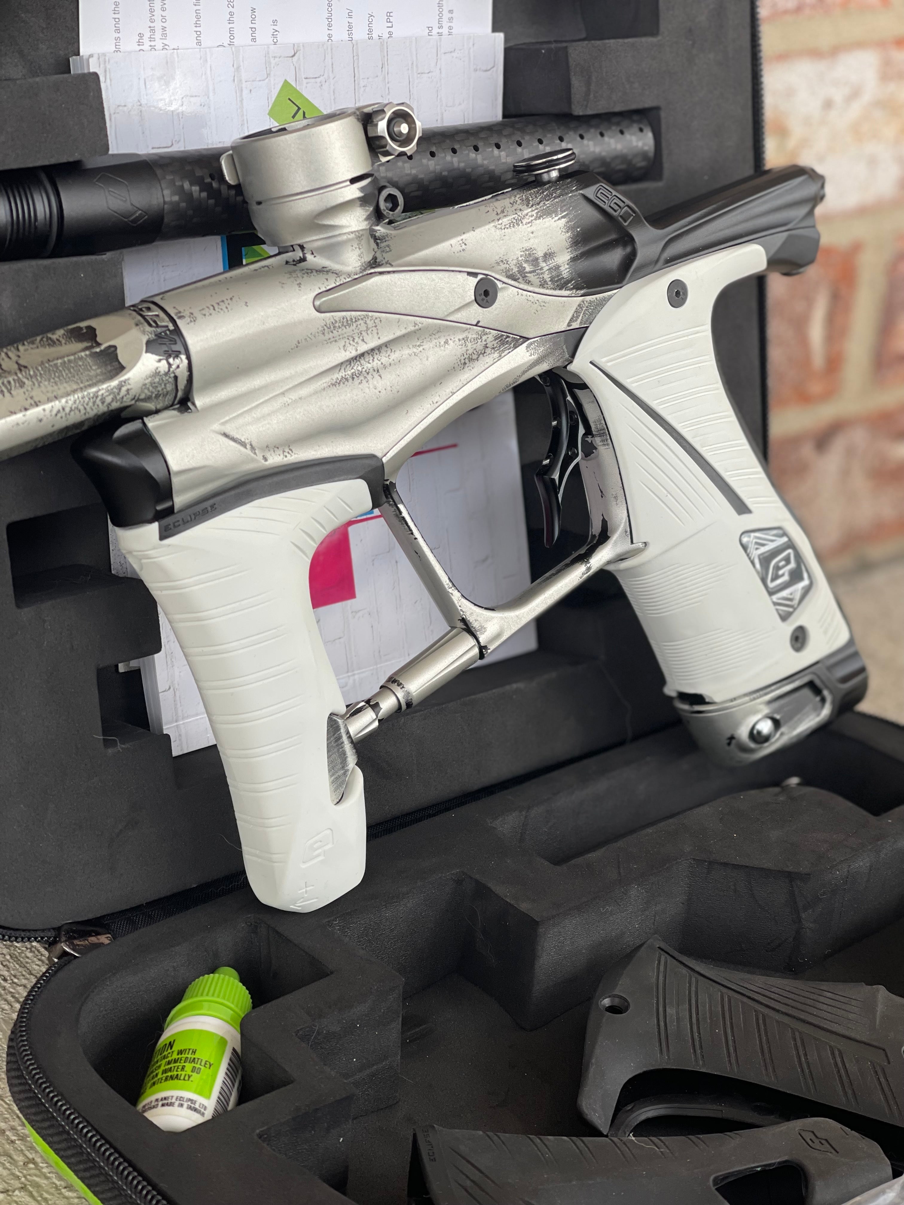 Used Planet Eclipse Ego Lv1.5 Paintball Marker- Silver/Black Fade Custom Anno w/ Infamous Deuce Trigger, White & Black Grips, Freak Barrel & Stock Barrel