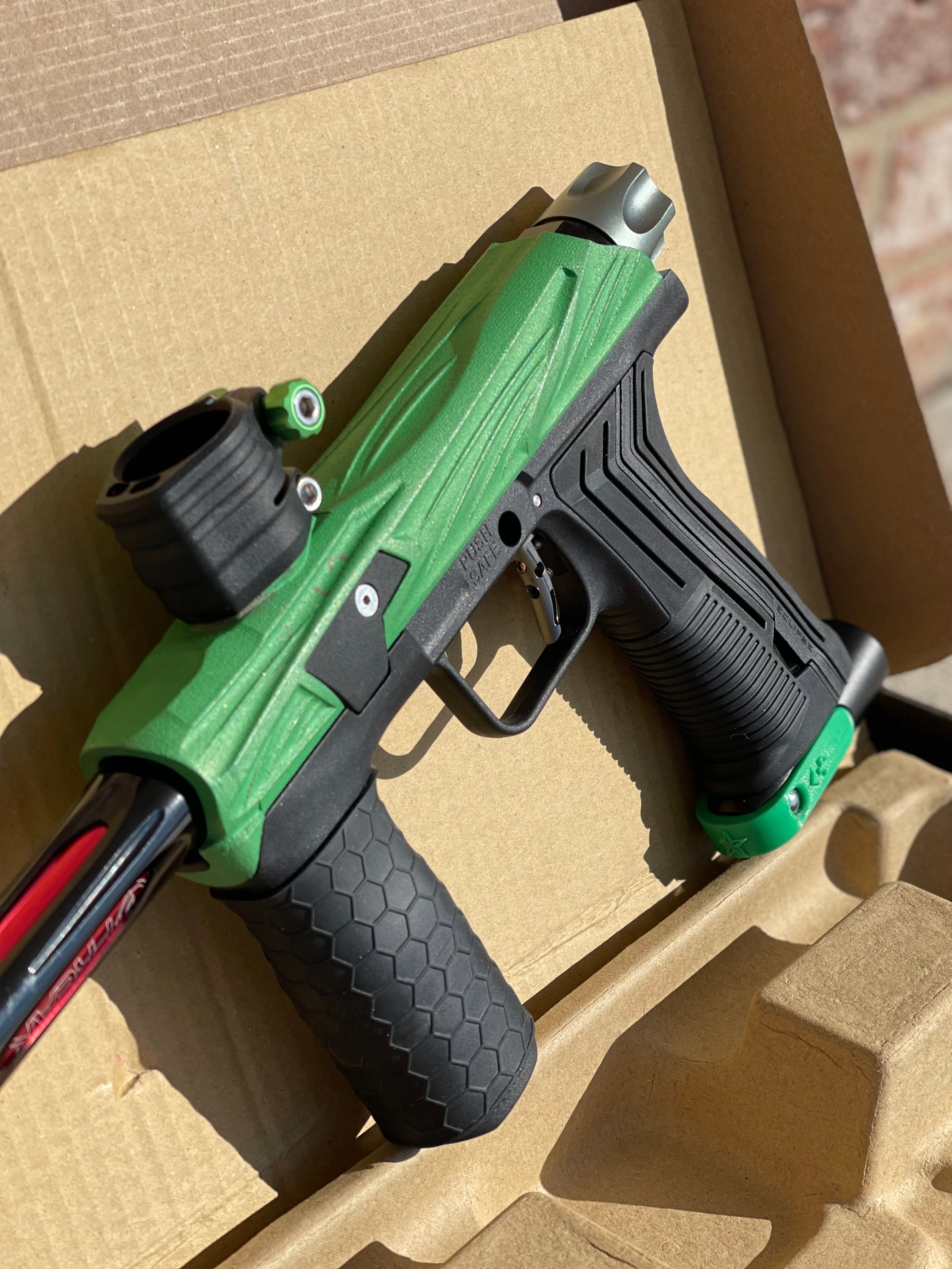 Used Planet Eclipse Emek 100 Paintball Gun - Green - Custom Body w/ Infamous Murder Trigger w/ Freak XL Barrel Kit, Hair 45 Trigger Valve, POPS ASA, Exalt Back Cap, Exalt Feedneck Lever, Rubber Front Grip Sleeve