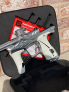 Used Planet Eclipse/HK Army Fossil LV1.6 XV Paintball Gun - Pure (Silver) w/ White and Black Grips, Infamous Silencio Barrel Tip, and Infamous Deuce Trigger