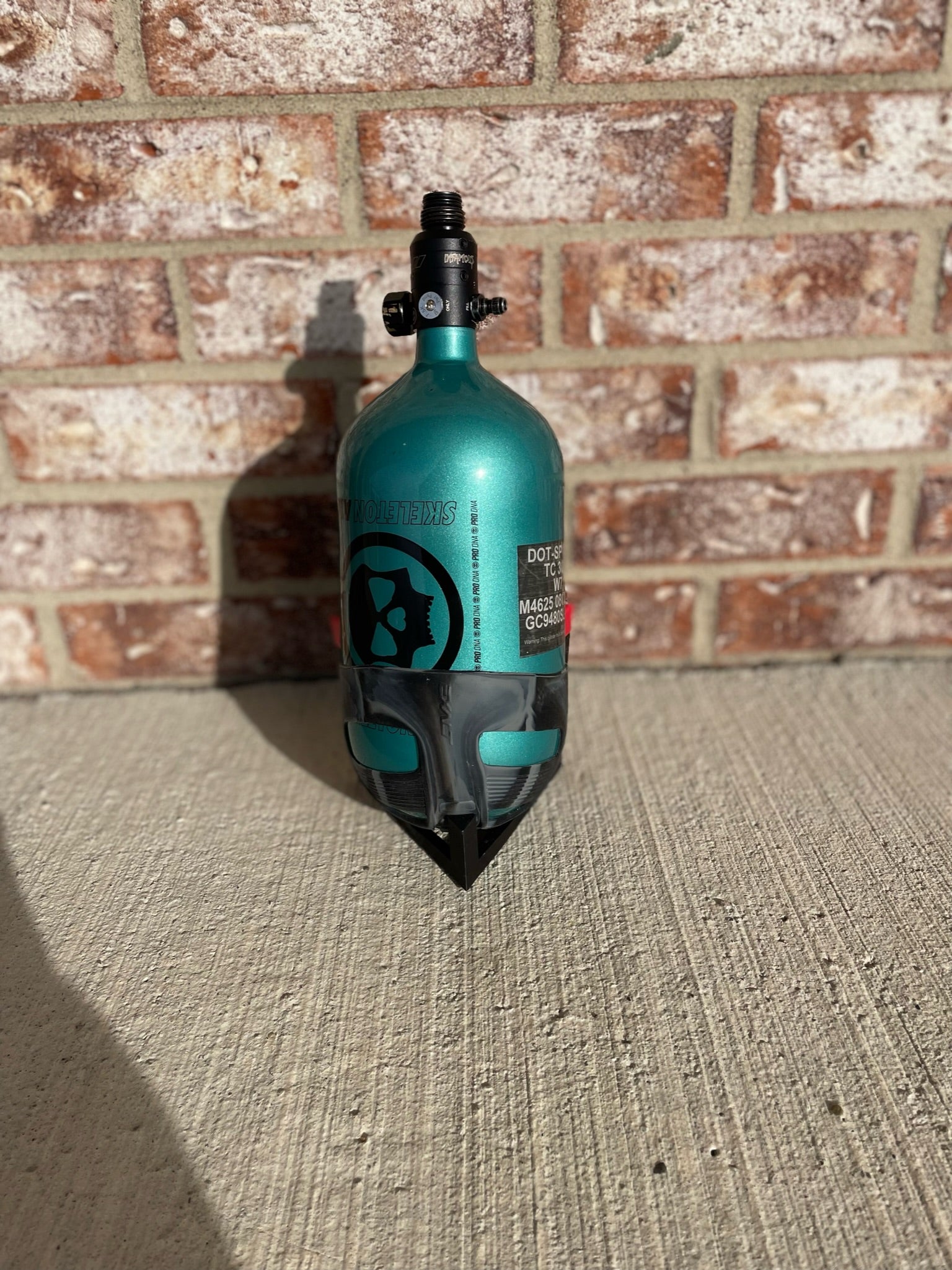 Used Infamous 80/4500 Skeleton Air Paintball Tank - Teal / Black w/ Infamous Powerhouse Regulator and Exalt Tank Cover