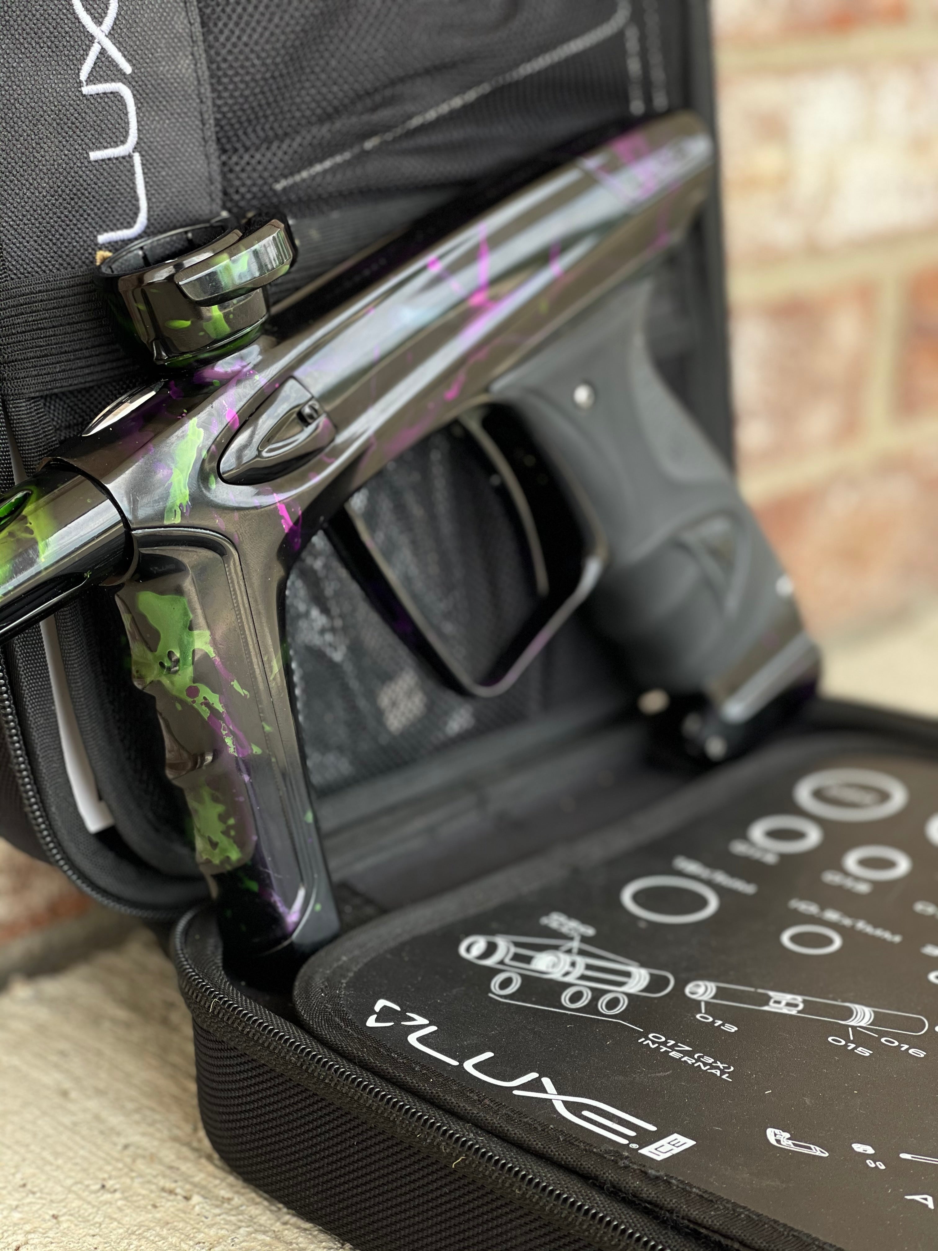 Used DLX Luxe Ice Paintball Gun - Acid Wash Green / Purple