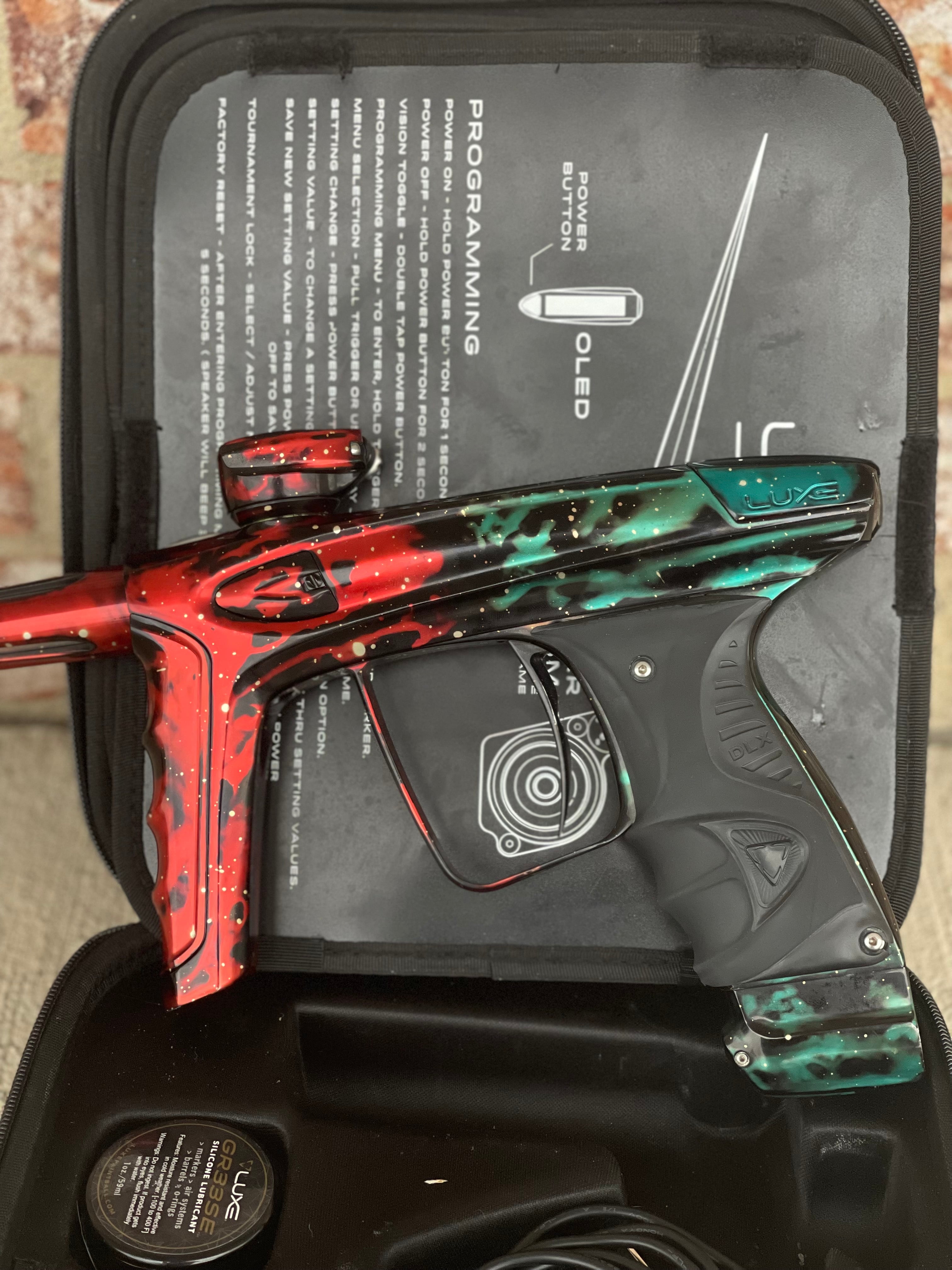 Used DLX Luxe Ice Paintball Gun - Red/Green Galaxy (1 of 15)