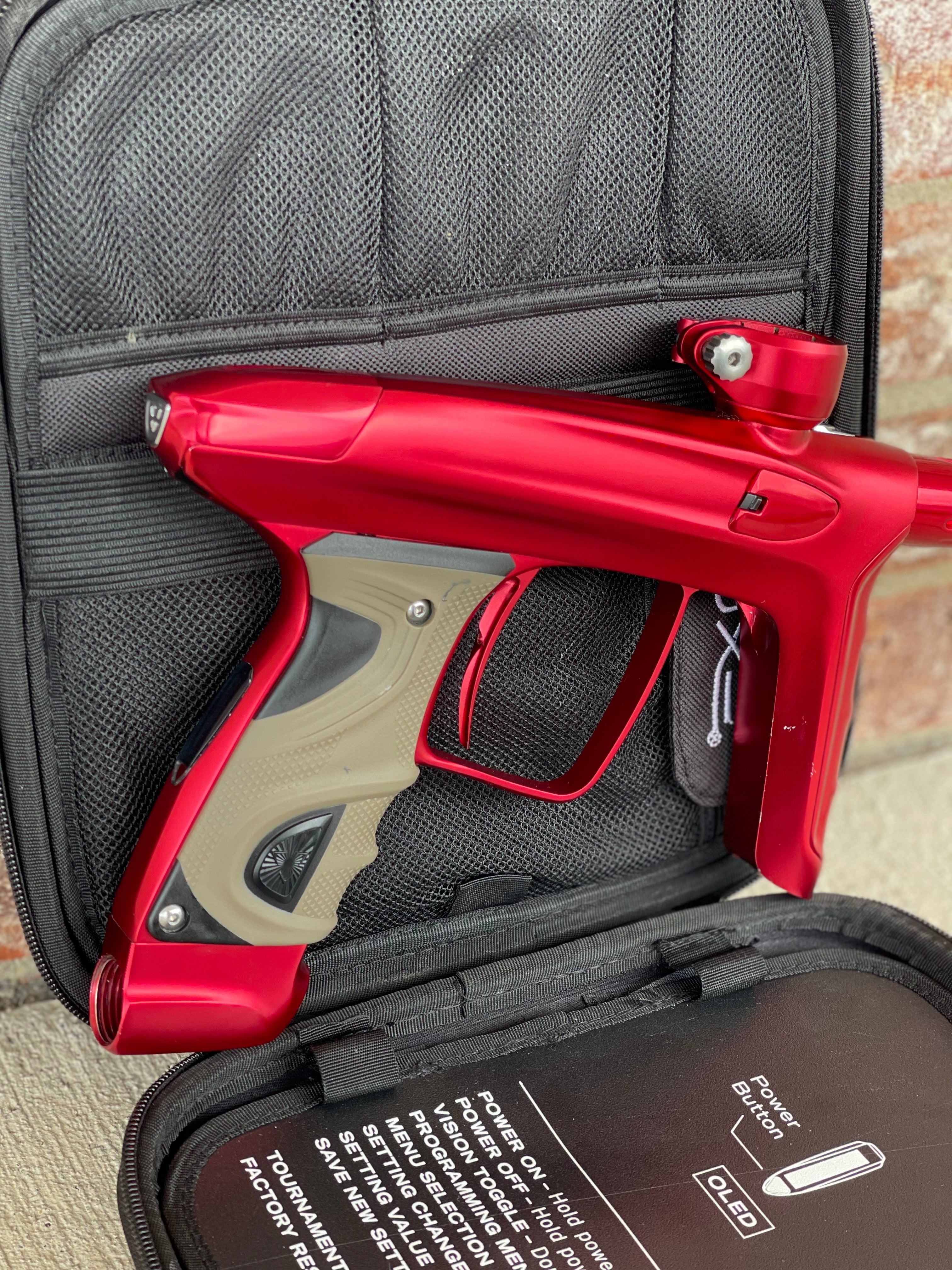 Used DLX Luxe TM40 Paintball Gun - Dust Red / Gloss Red w/ 2 back grips and SSC Soft Tip Bolt