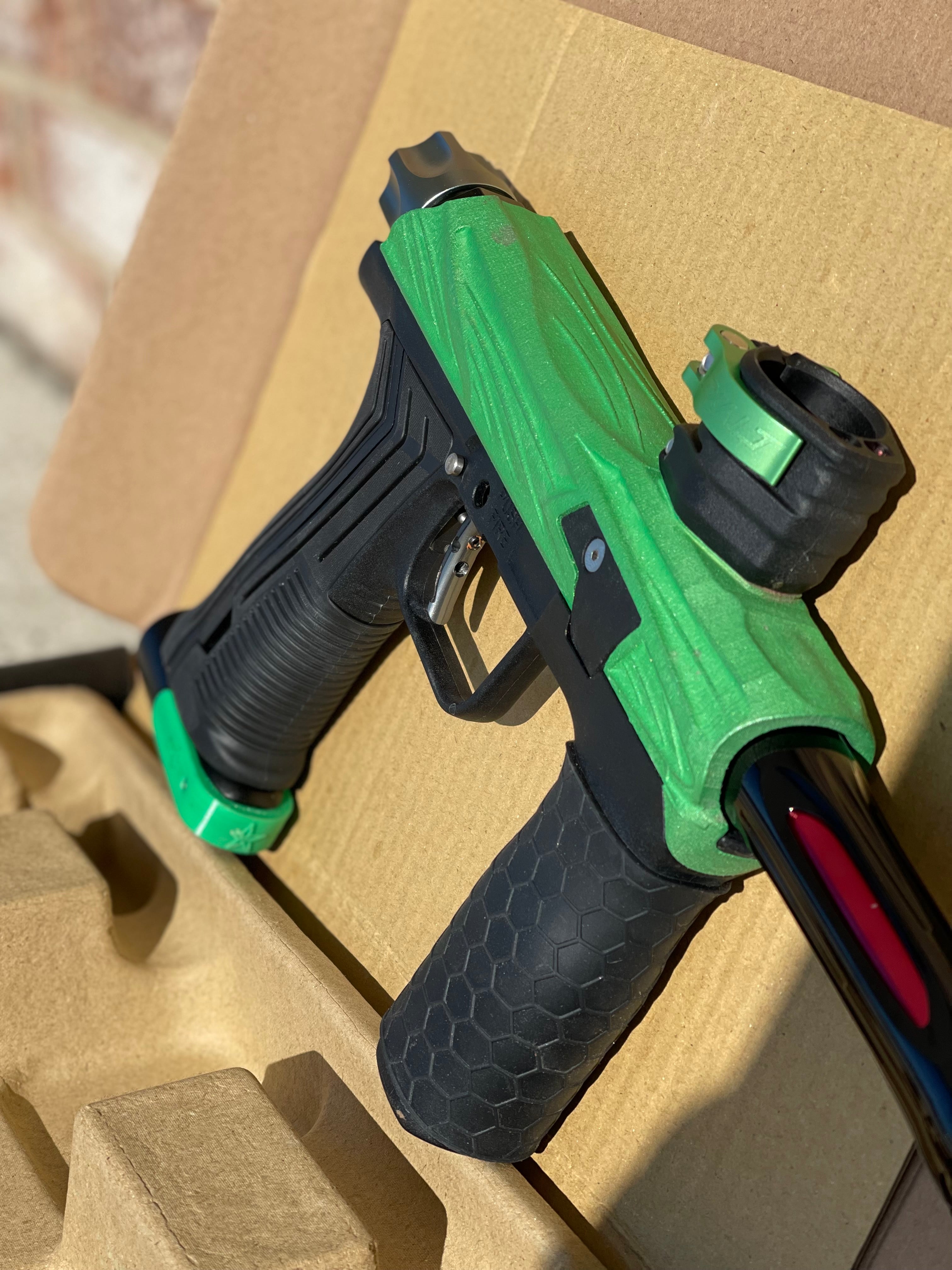 Used Planet Eclipse Emek 100 Paintball Gun - Green - Custom Body w/ Infamous Murder Trigger w/ Freak XL Barrel Kit, Hair 45 Trigger Valve, POPS ASA, Exalt Back Cap, Exalt Feedneck Lever, Rubber Front Grip Sleeve