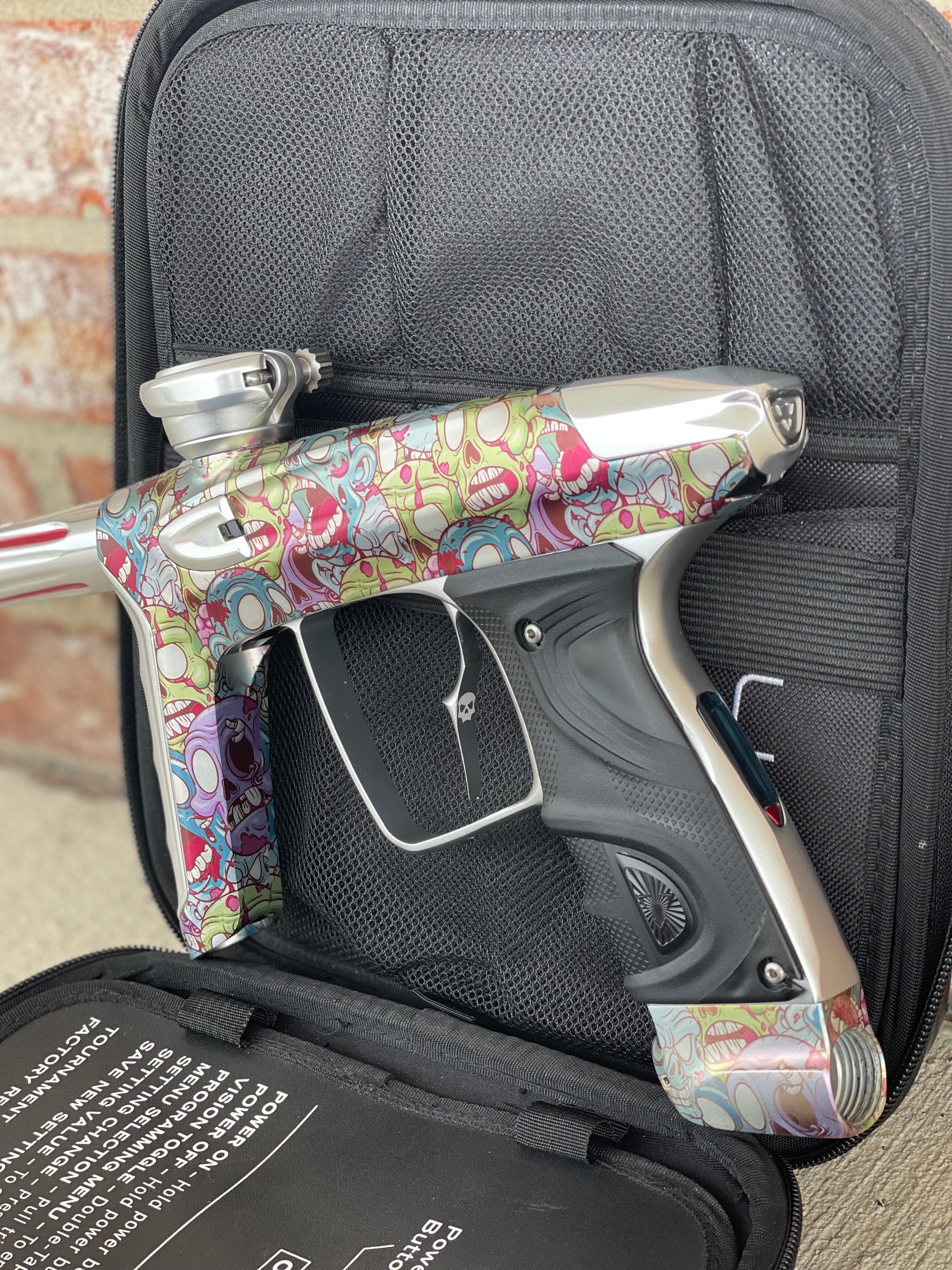 Used DLX Luxe TM40 Paintball Gun - LE Zombie Edition w/Silver Deuce Trigger & Wireless Charger