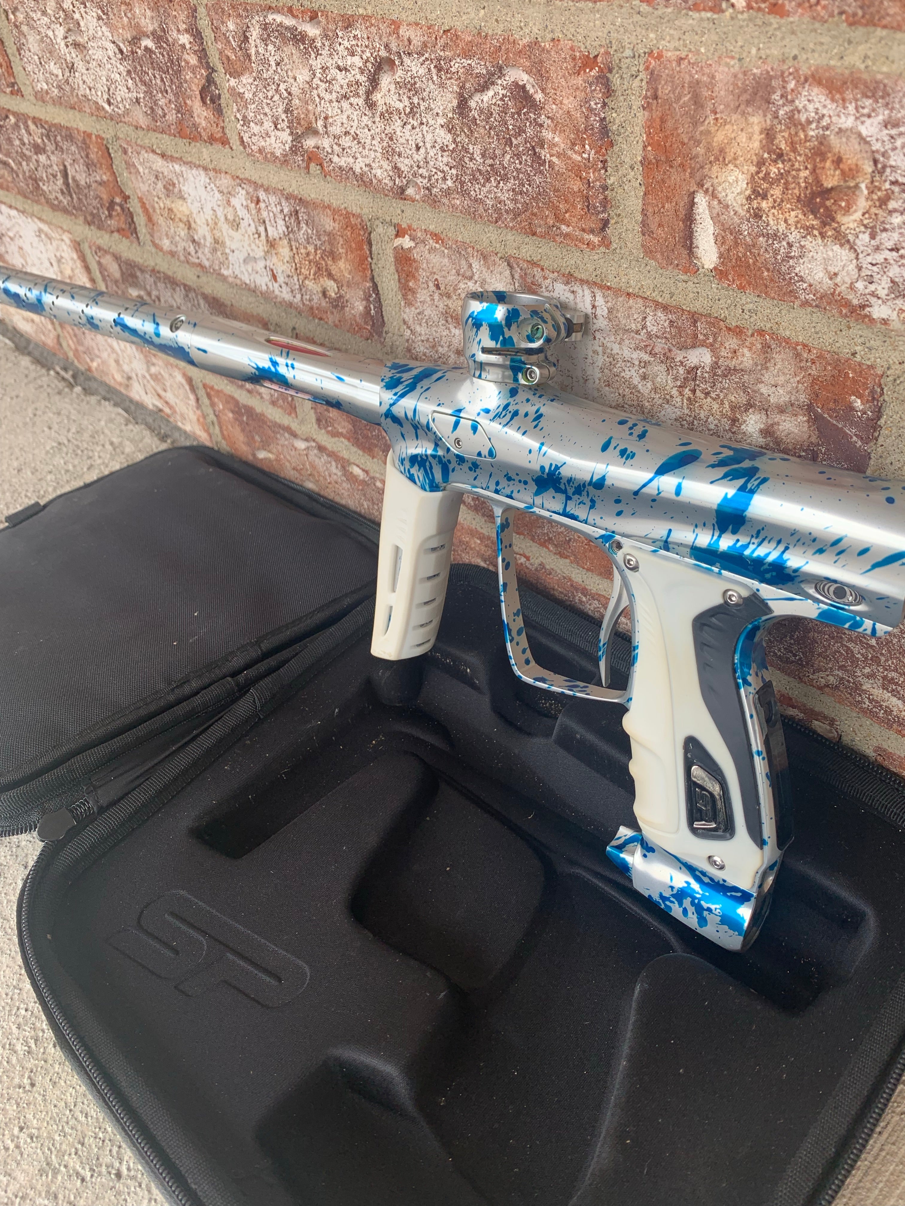 Used Shocker RSX Paintball Marker - Silver/Blue Splash